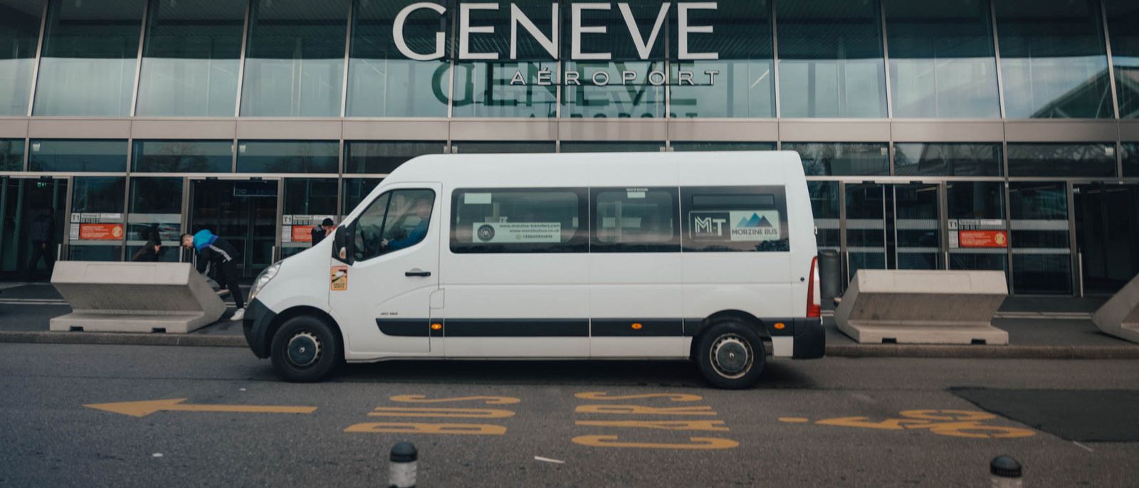 Morzine Bus minibus outside the Geneva Airport terminal