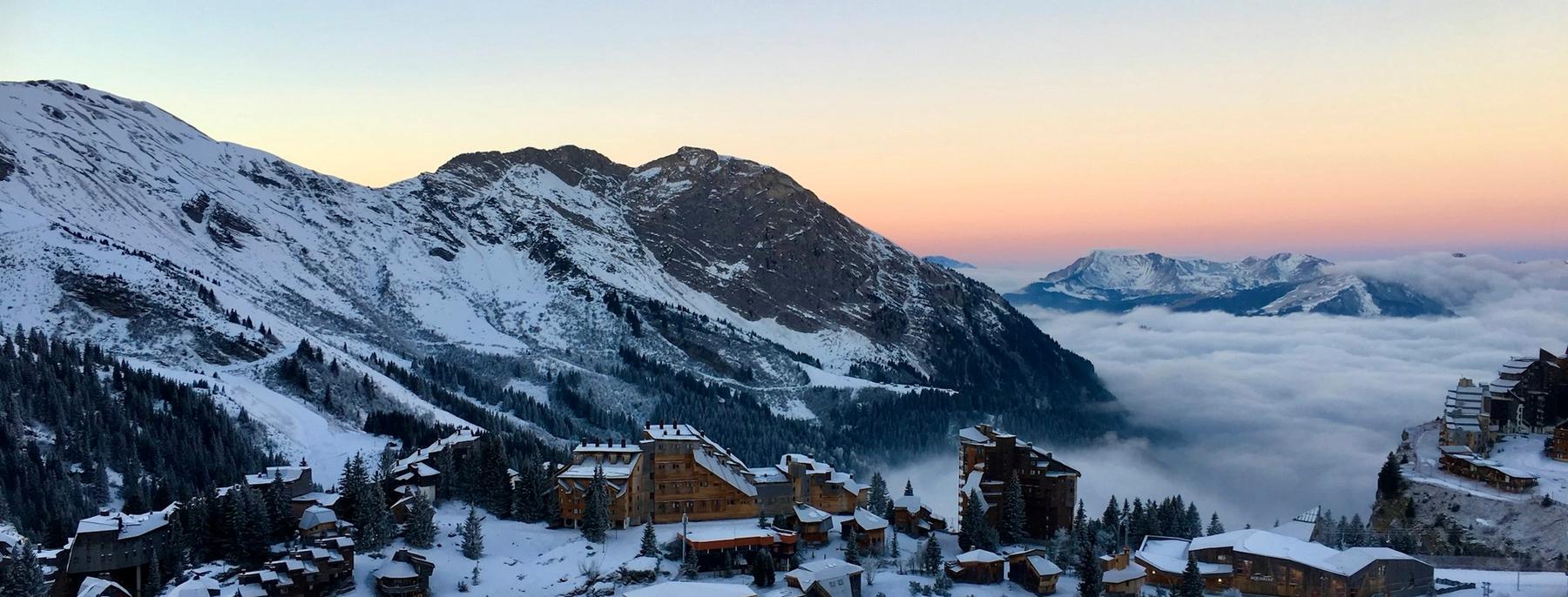 Sunset over the Portes du Soleil mountains above a sea of cloud, seen from Avoriaz
