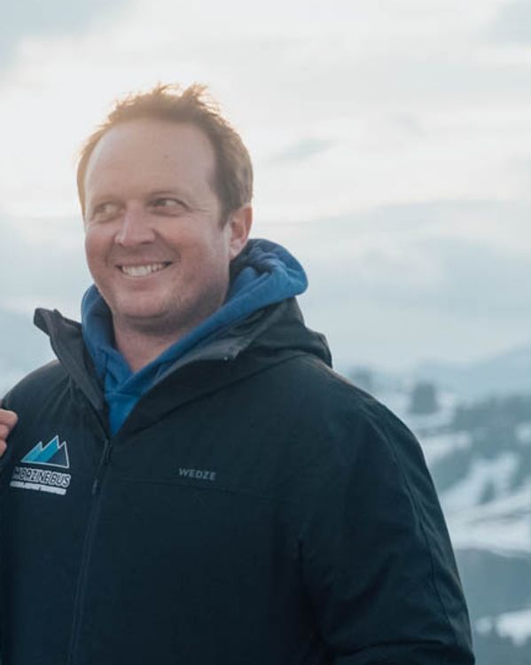 Owen Morris, founder of Morzine Bus, in the snow above Morzine