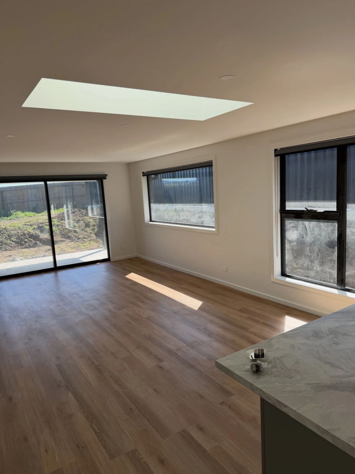 New-build open-plan living area with skylight