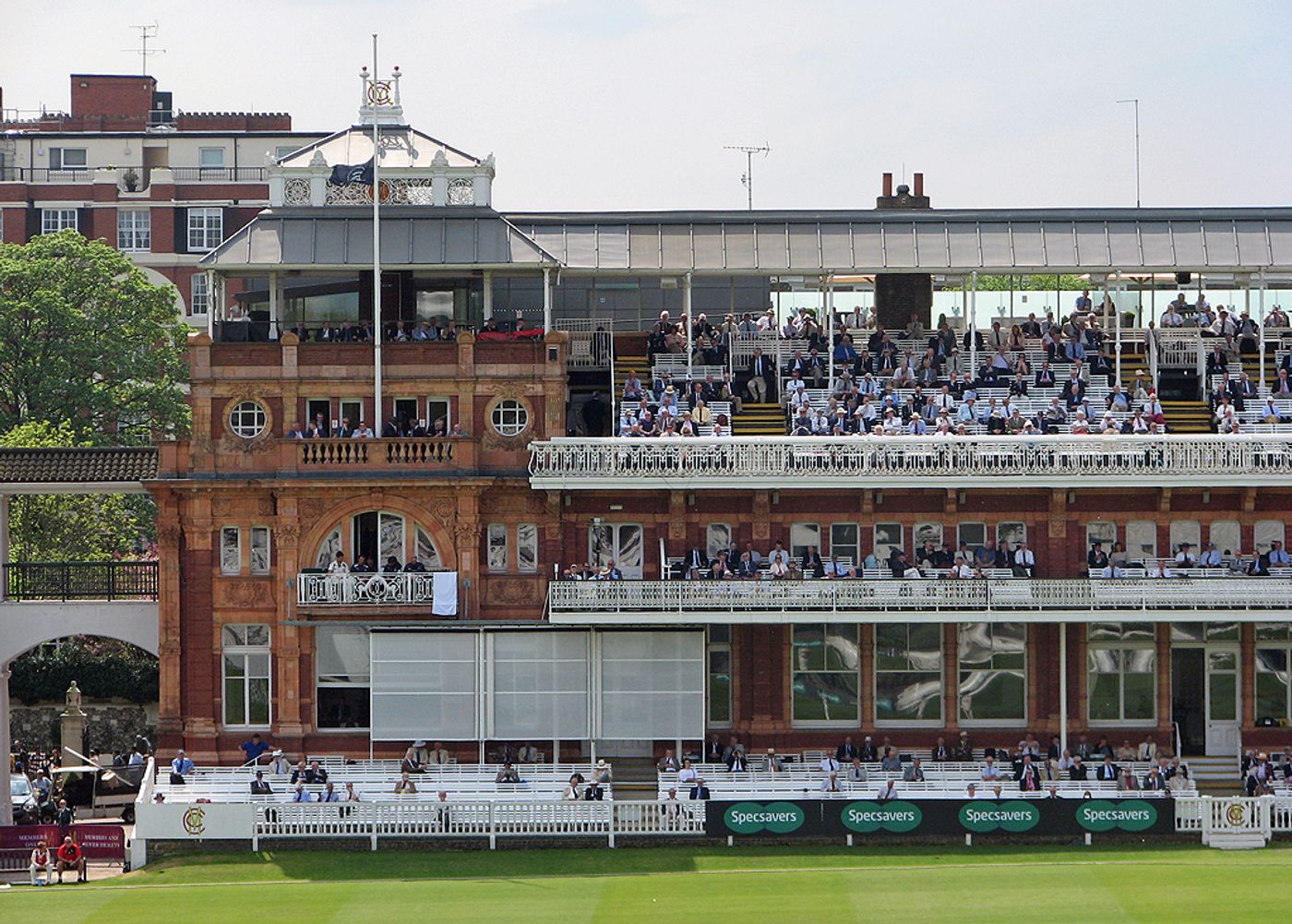 Spectators watching a cricket match in progress at Lord's Cricket Ground in London.