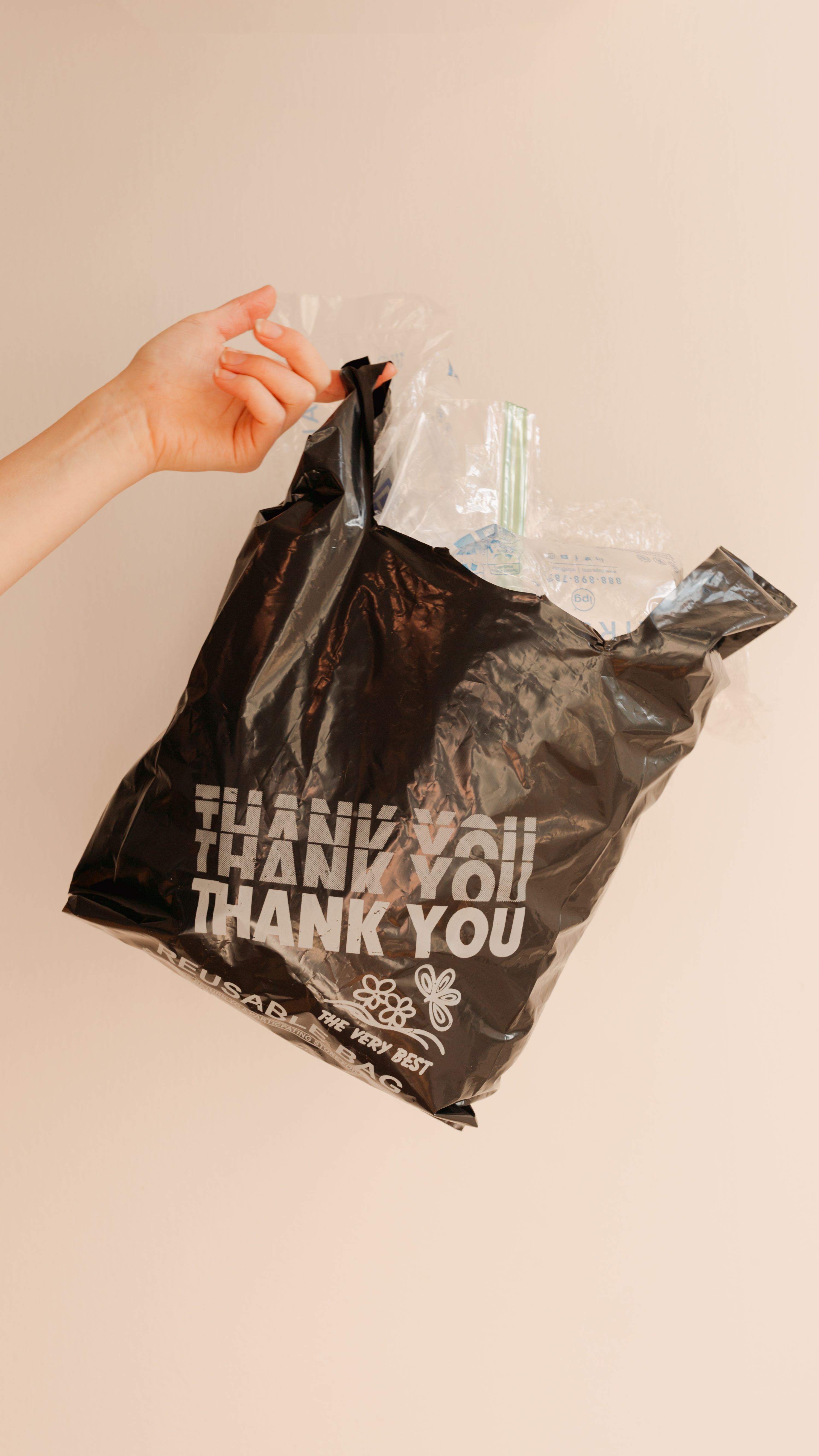 hard to recycle plastic film in a black plastic thank you bag