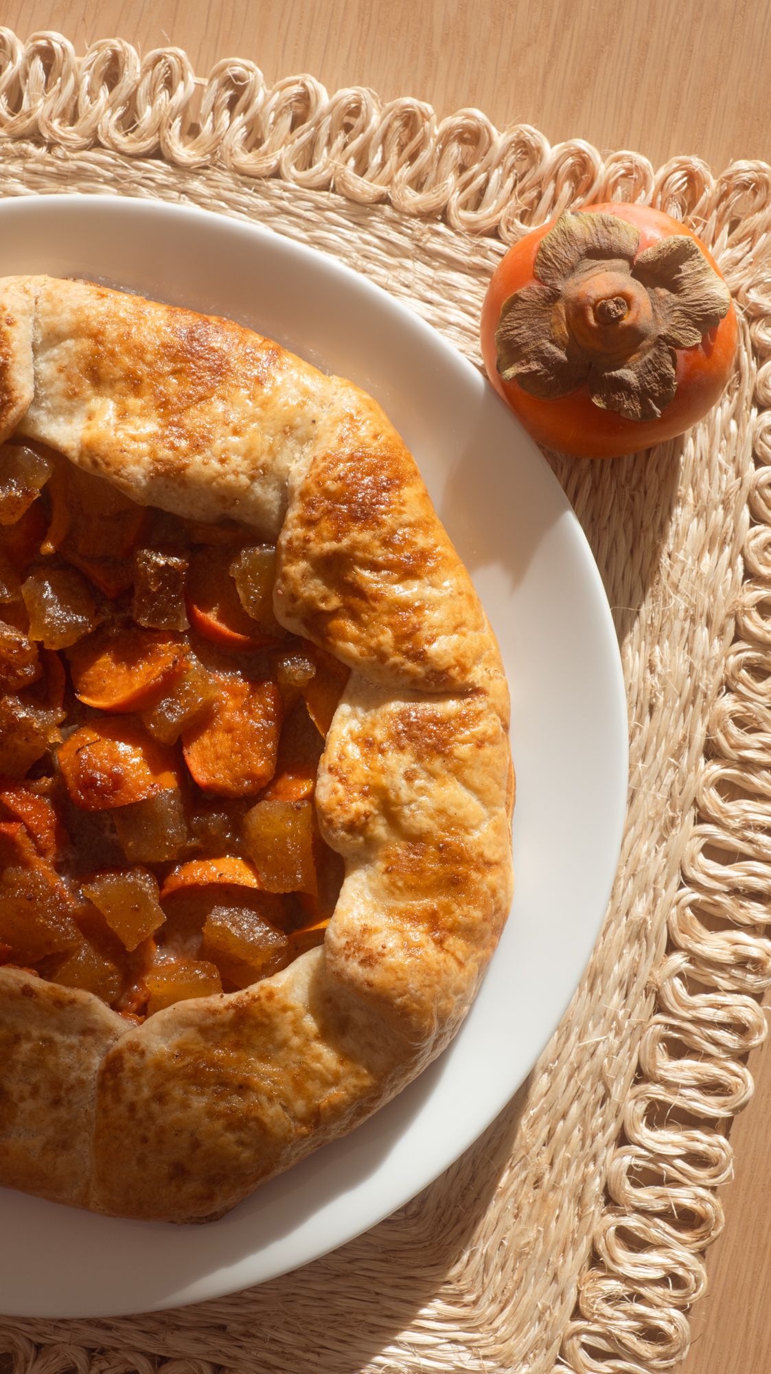 Persimmon & Candied Ginger Galette on a wicker placemat