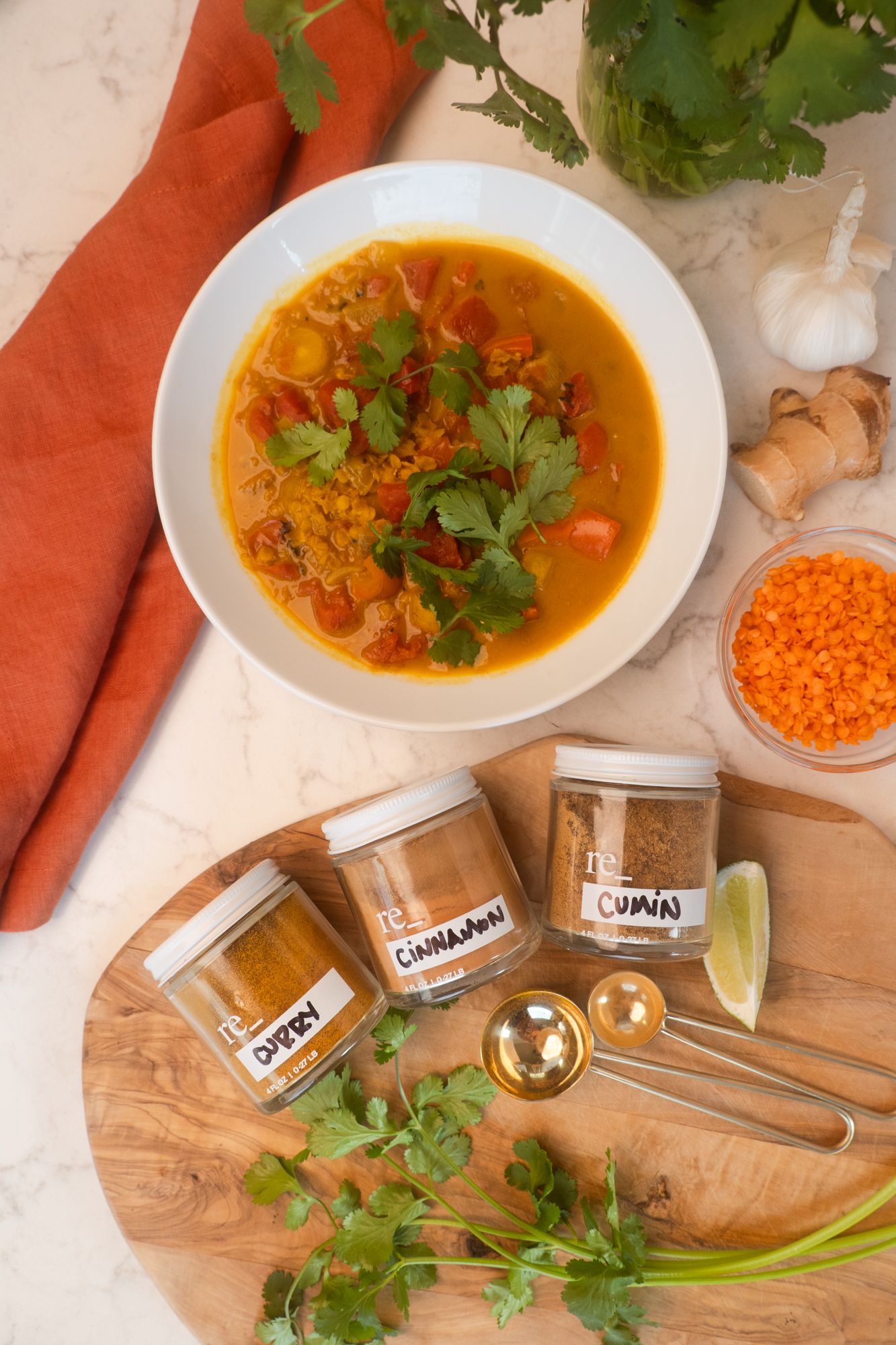 vegan curried lentil stew with fresh cilantro and lime using re_ grocery spice bundle