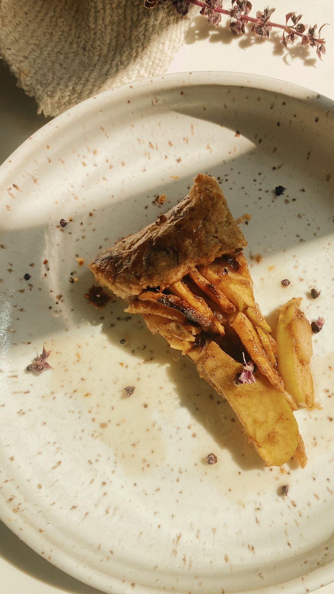 apple galette on a speckled plate