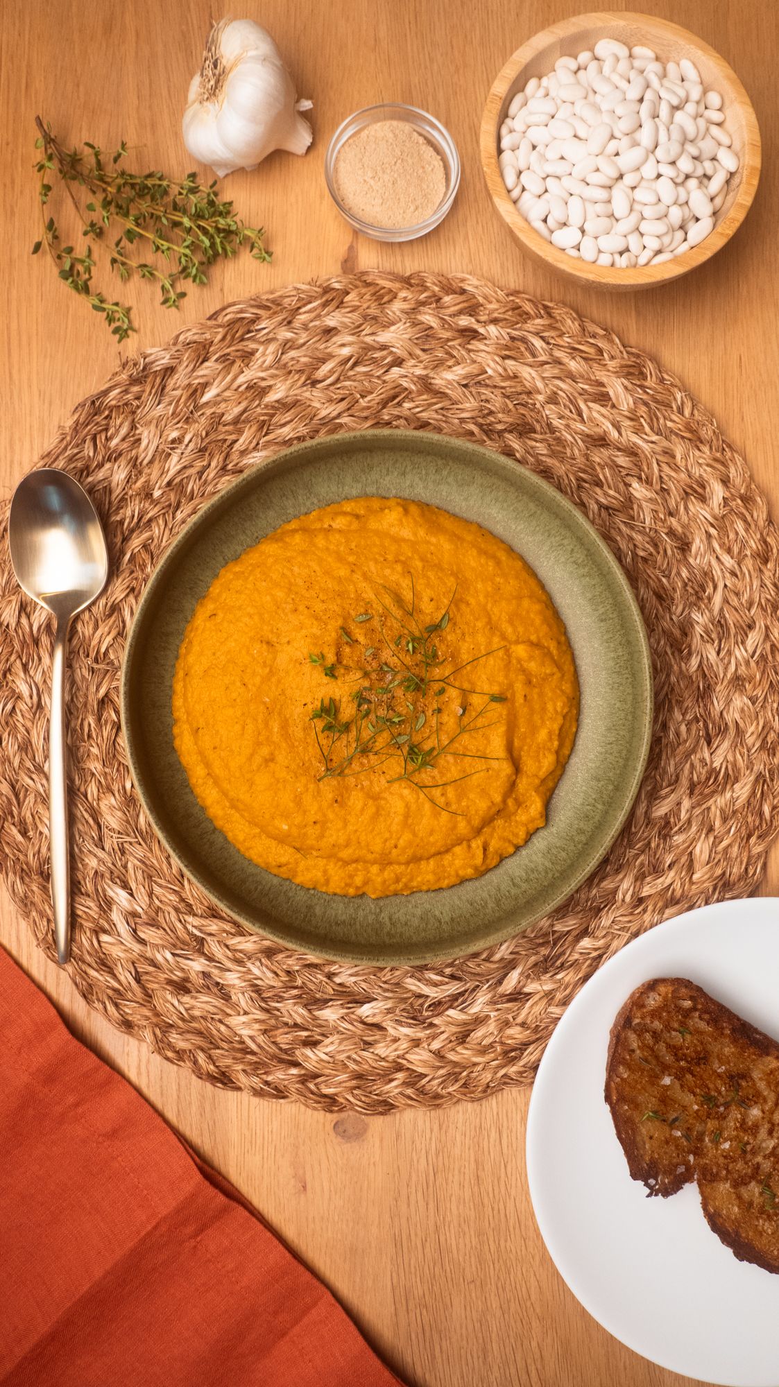 Roasted Fennel Soup With Apple + White Beans on a woven placemat