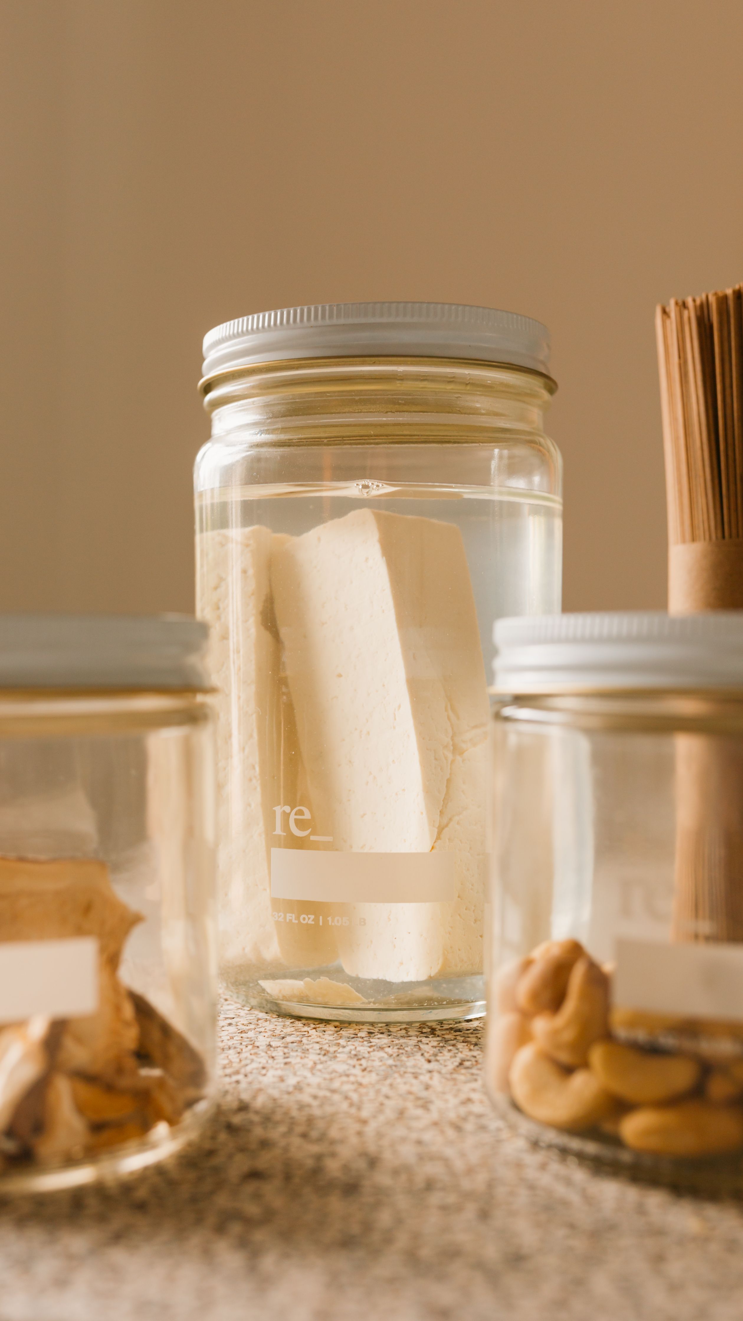 tofu and nuts in a glass jar