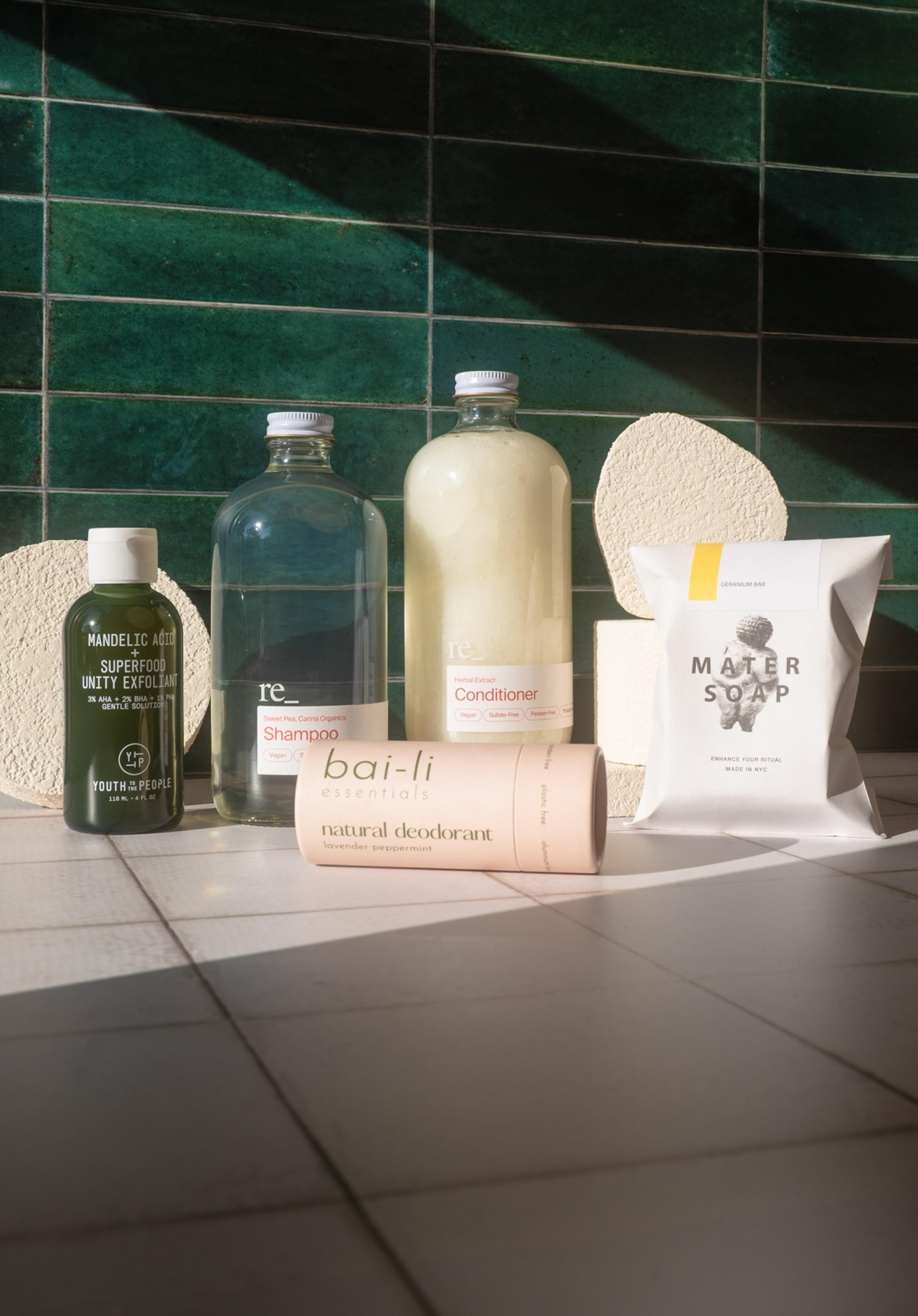youth to the people, mater soap, bai li deodorant and re_ grocery soaps on display in a bathroom