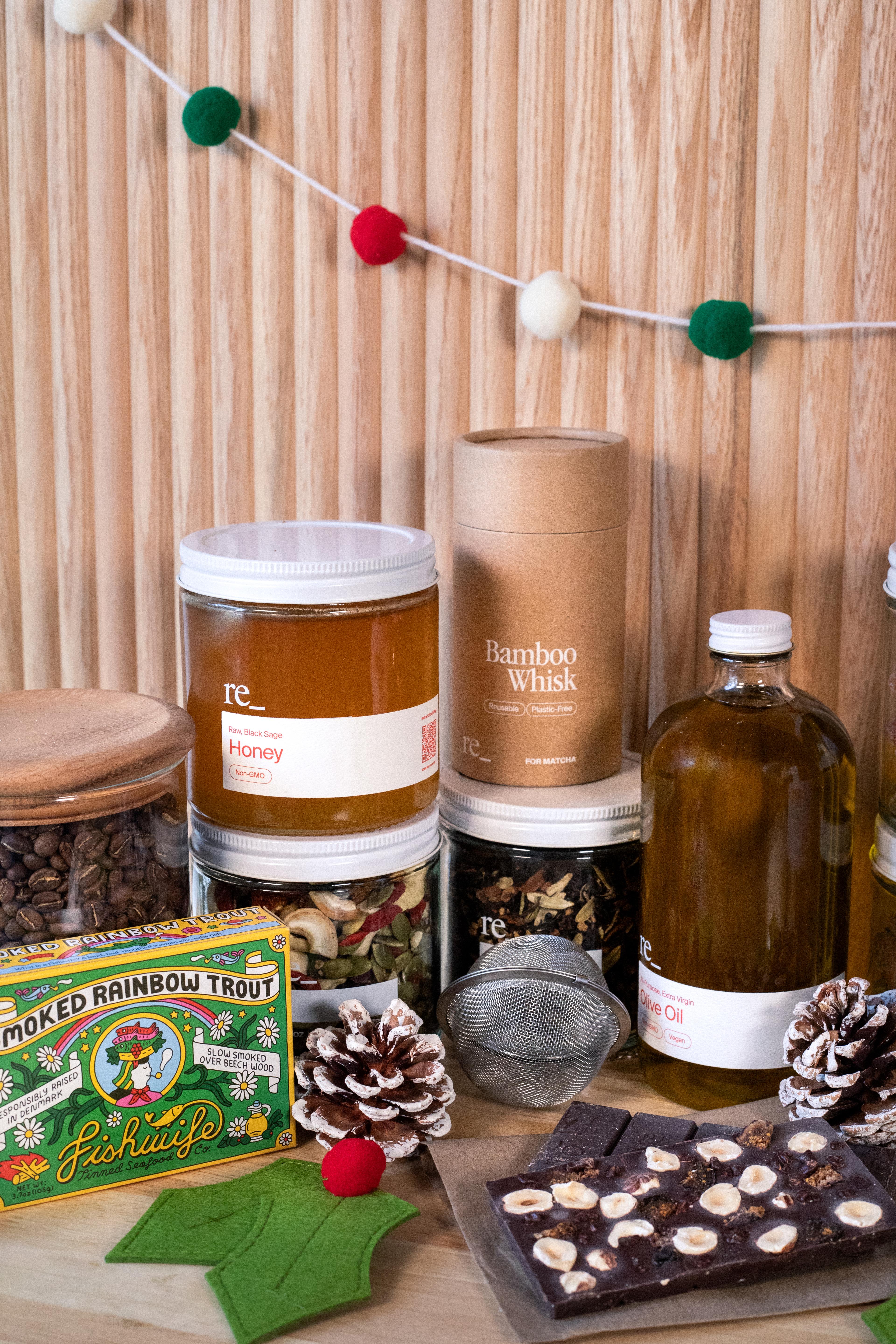 holiday gifts from re_ grocery including chocolate bars, fishwife tinned fish, honey, matcha whisk and olive oil