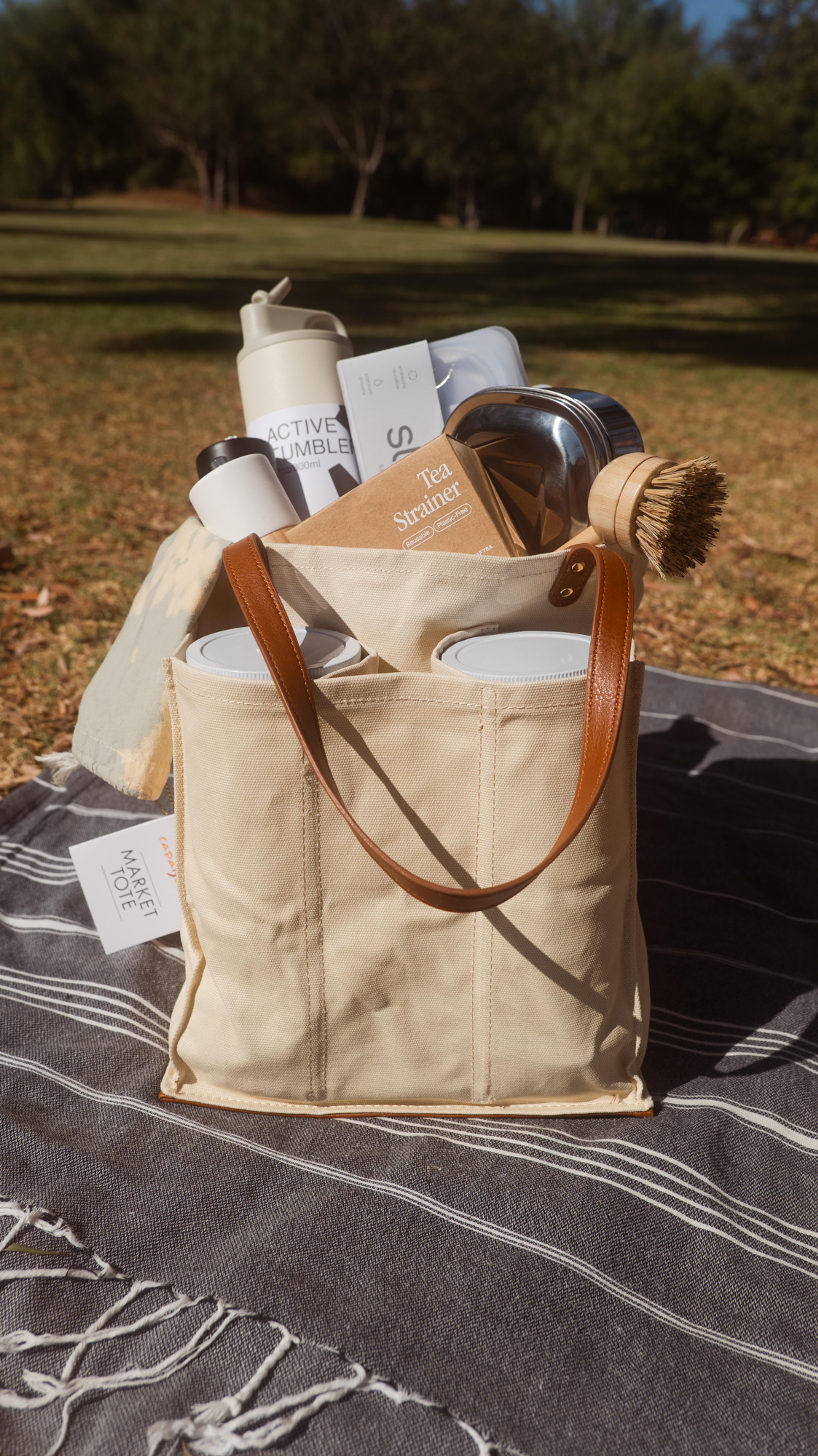 reusable, plastic free eco containers on a picnic blanet
