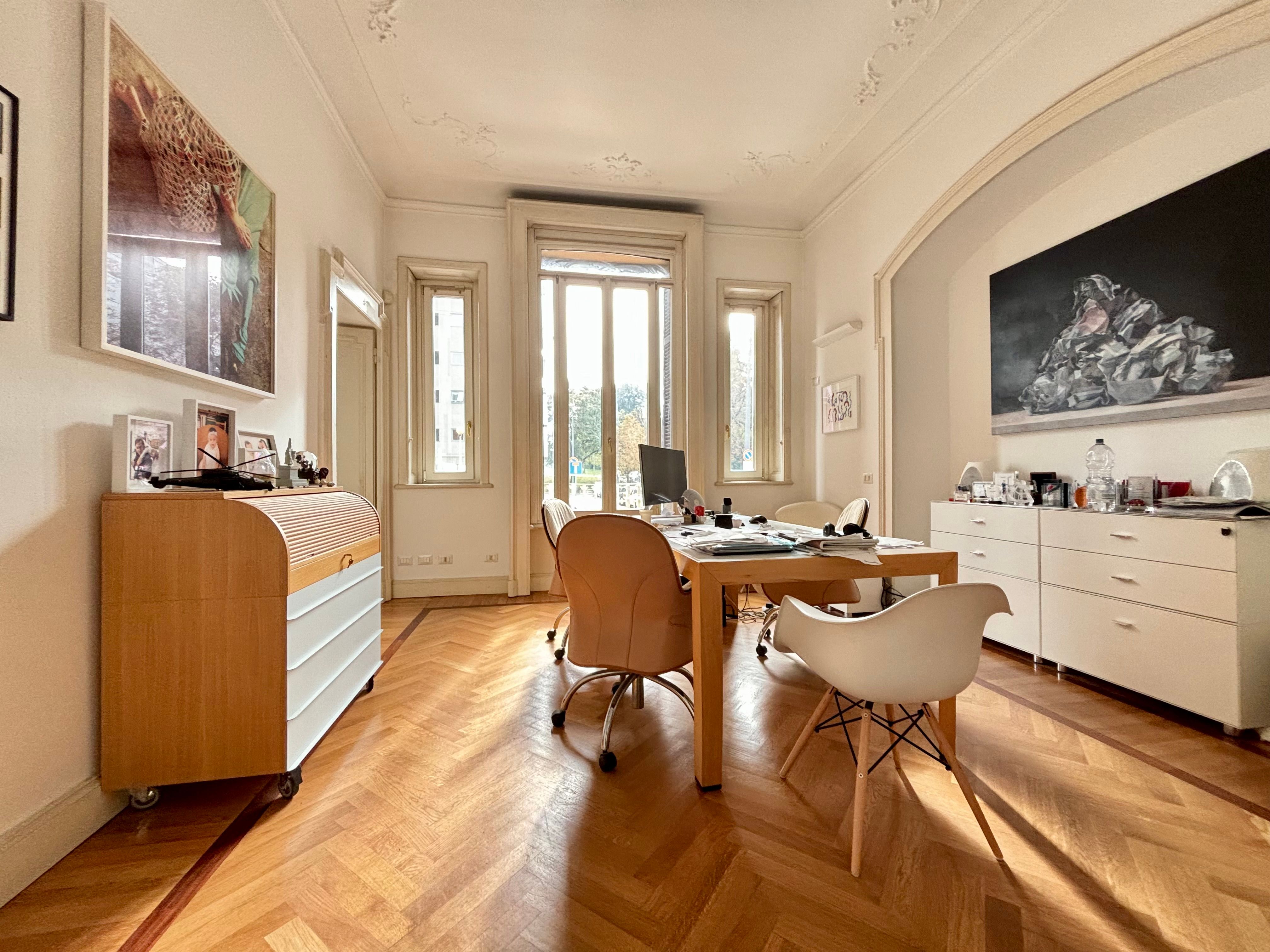 bright dinig room, chest of drawers, paintings