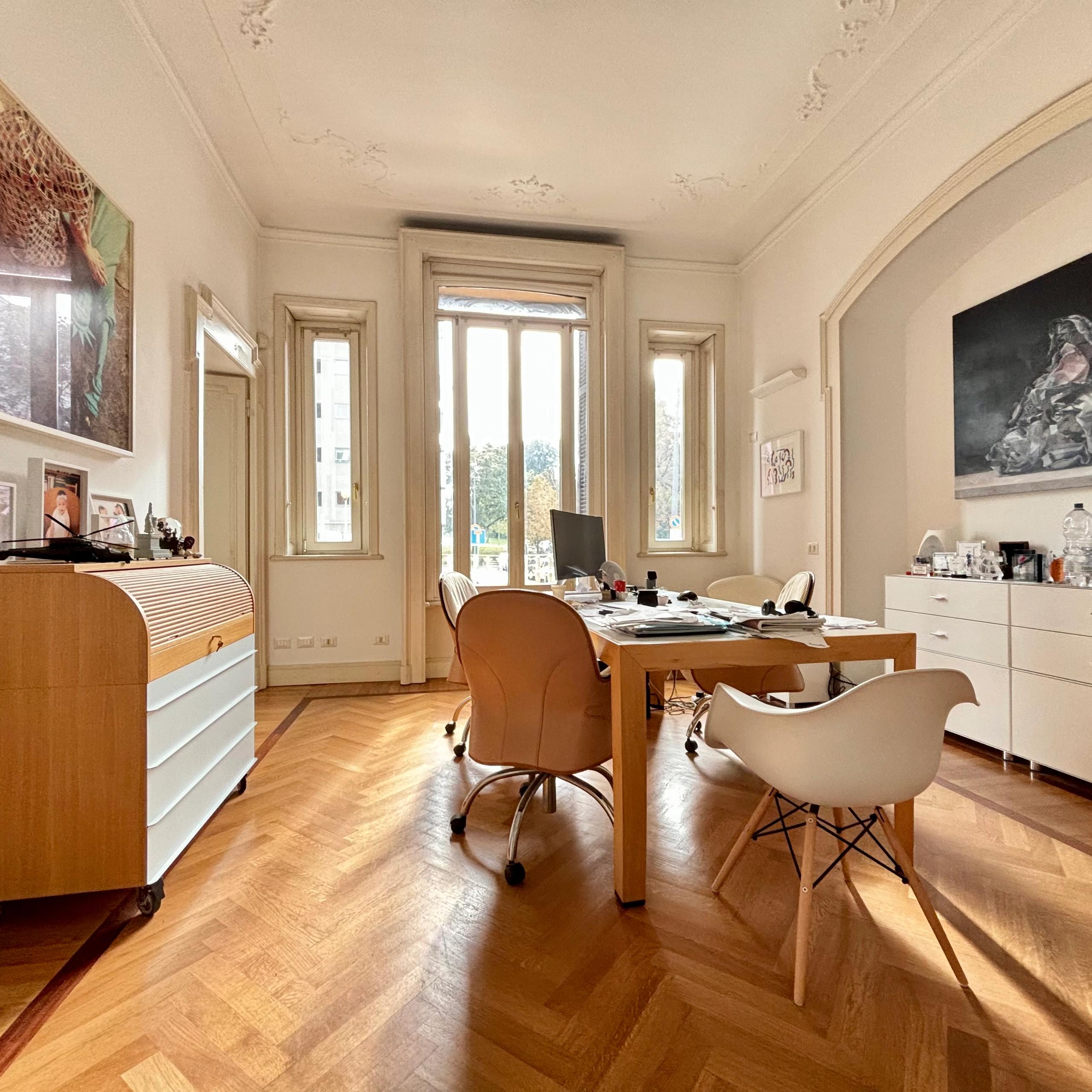 bright dinig room, chest of drawers, paintings