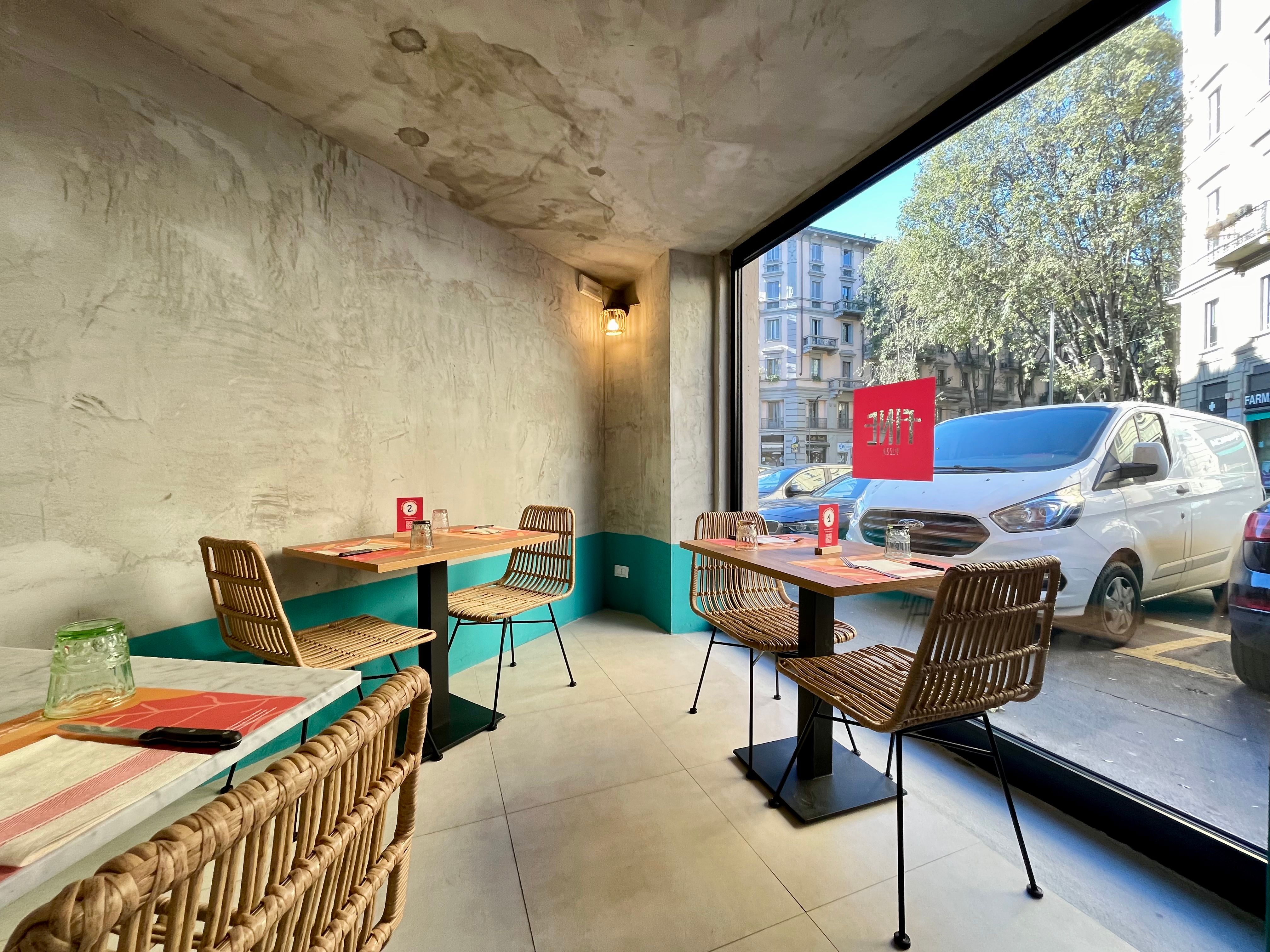 large display, table with chairs, van