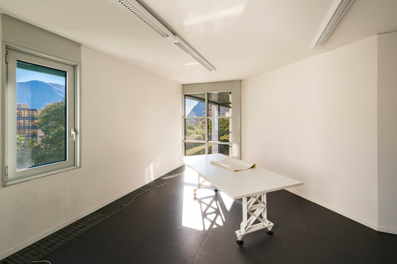 room with windows, desk