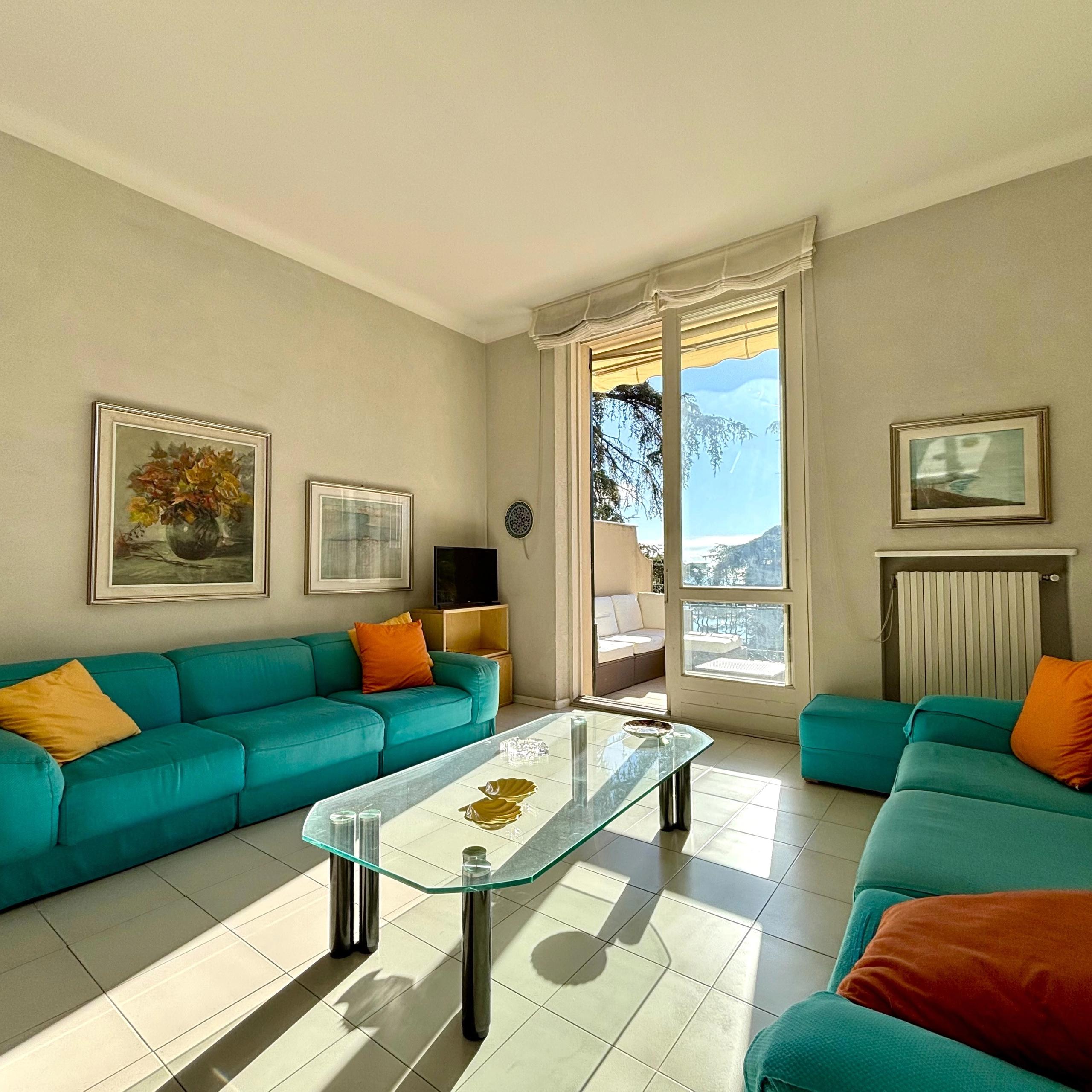 living room, doorway to the terrace, sky, coffe table, cauch with pillows