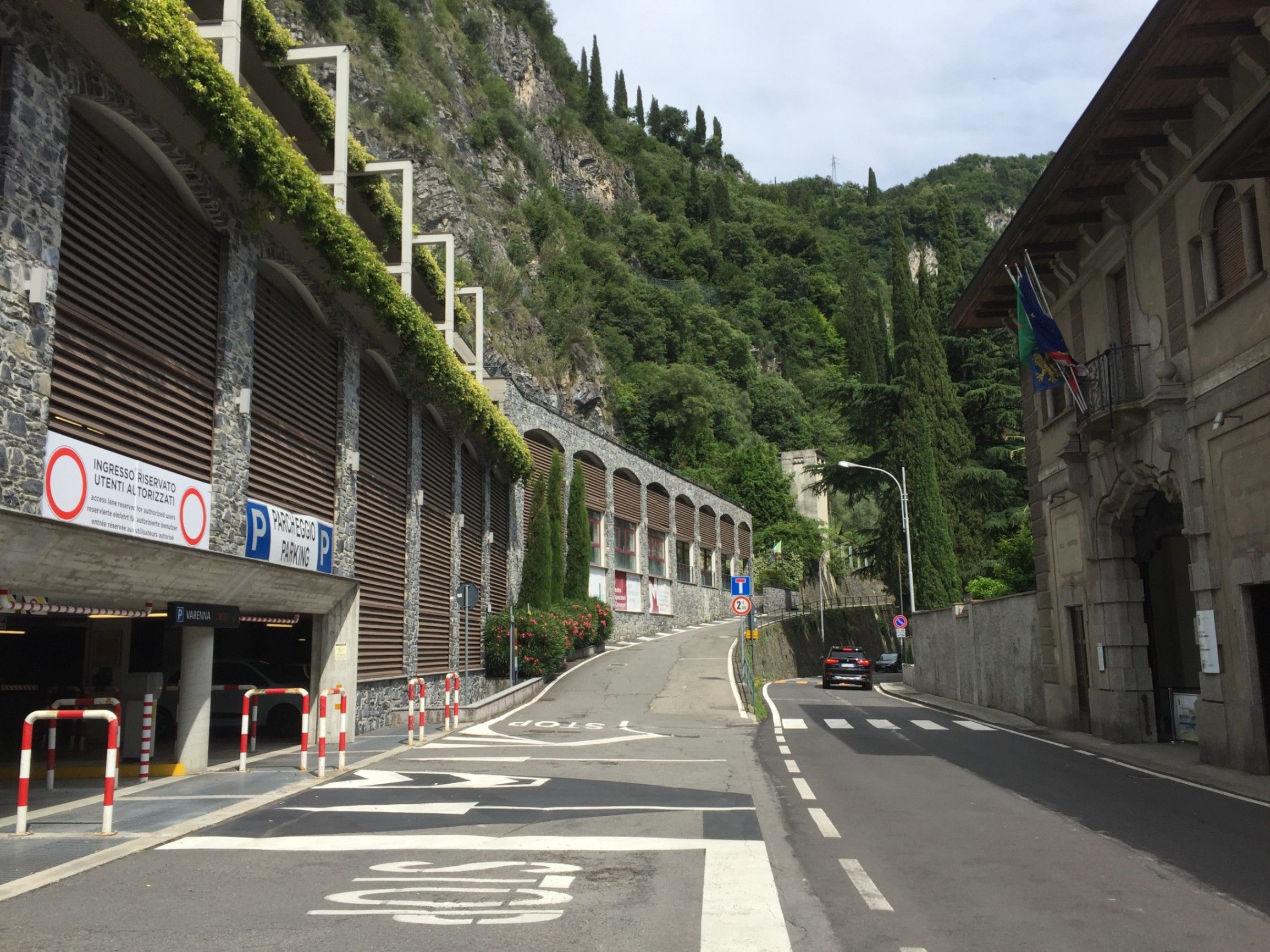 Street below the promontory, old houses, entrance to the building housing garages of various sizes