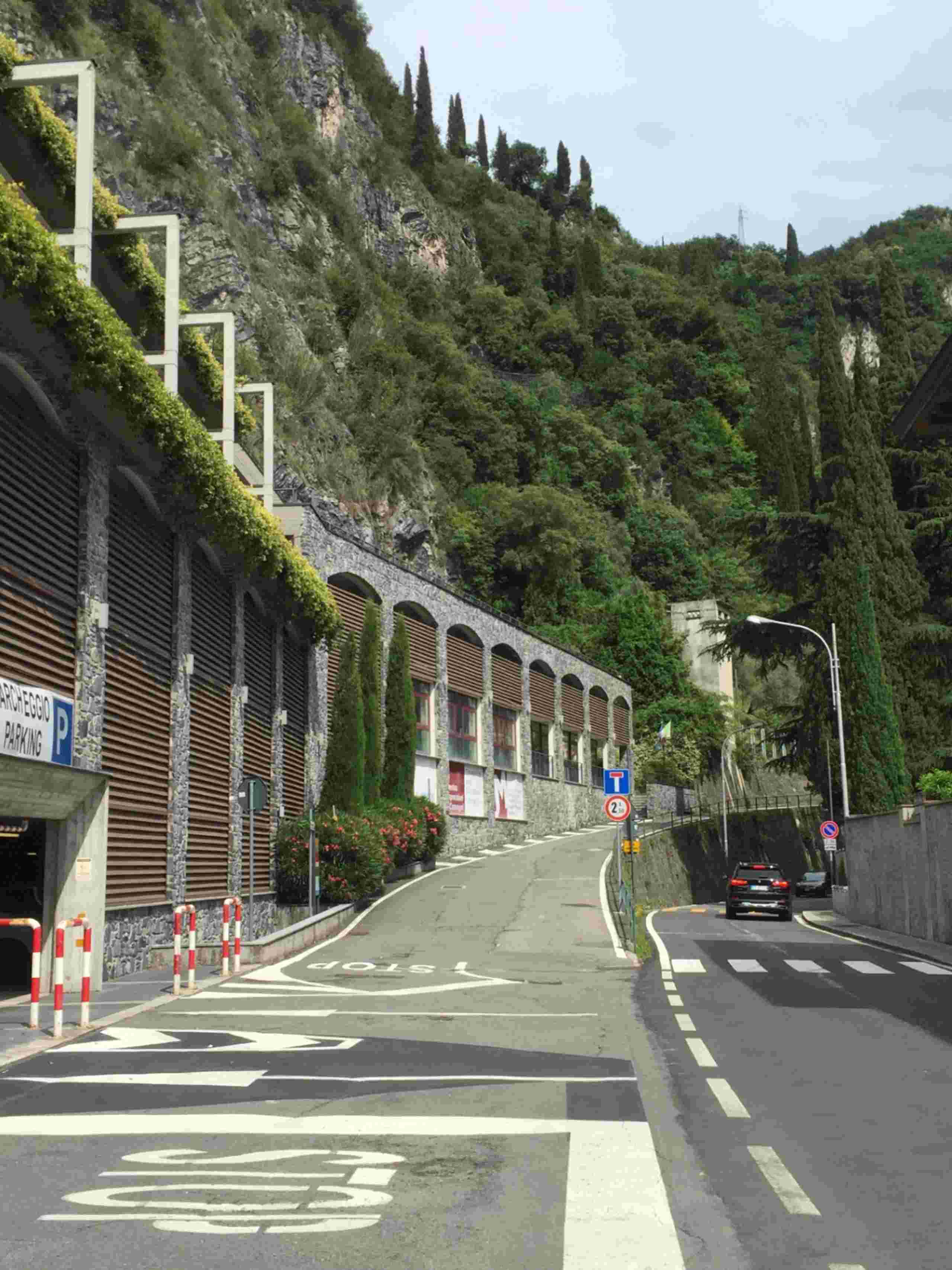 Street below the promontory, old houses, entrance to the building housing garages of various sizes