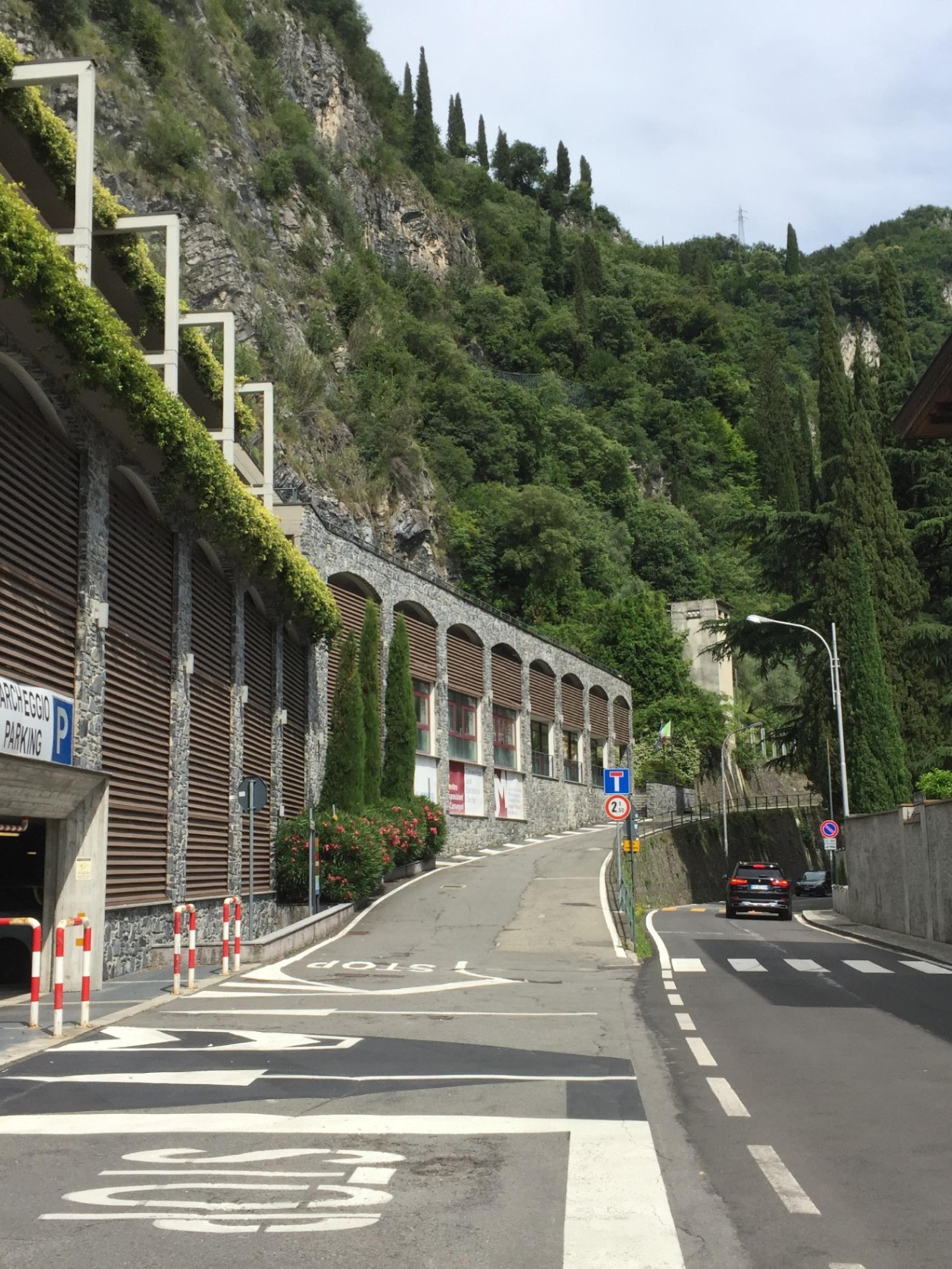 Street below the promontory, old houses, entrance to the building housing garages of various sizes
