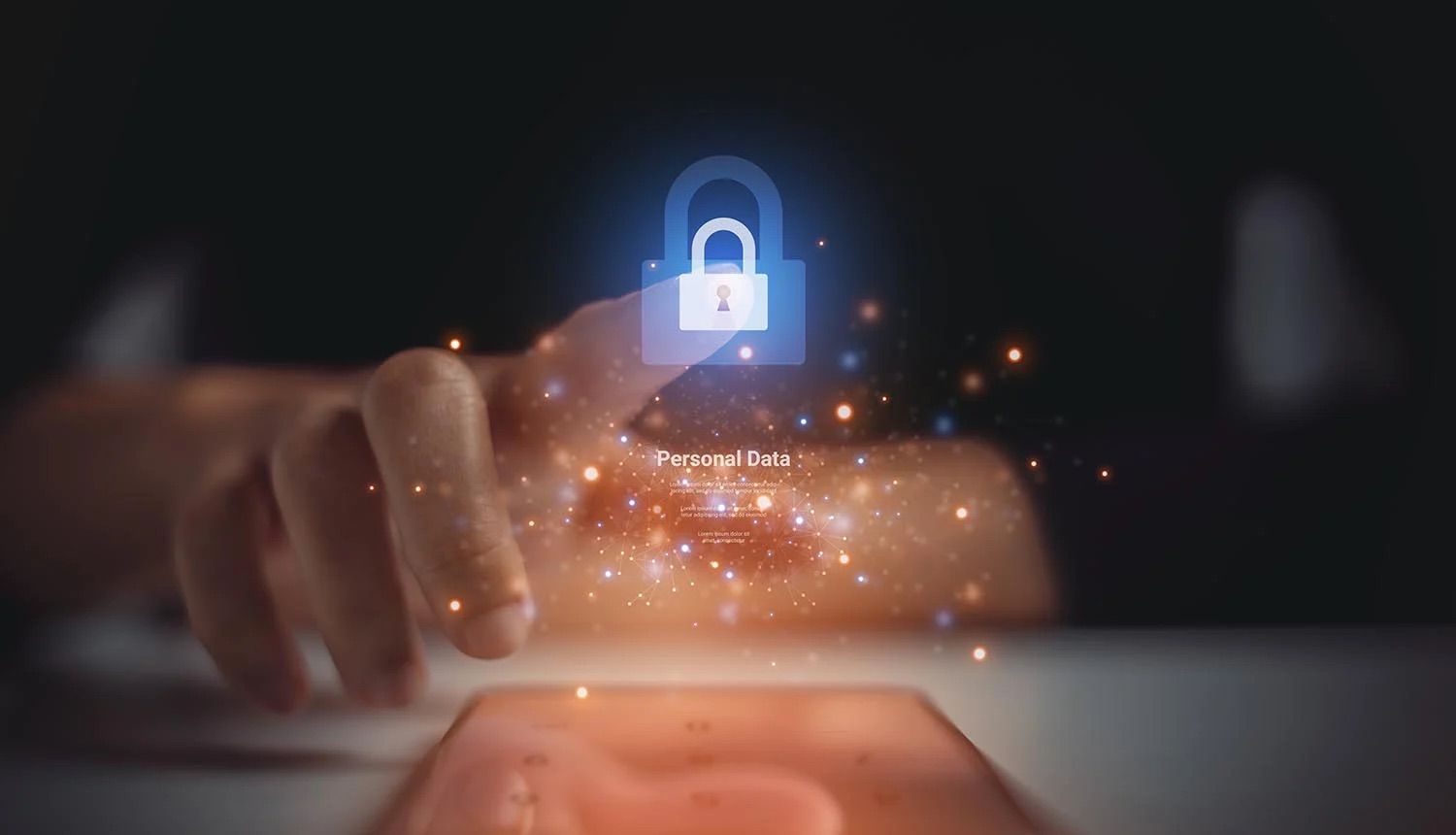 A composite image of a hand above an iPad, pointing to a padlock, with the words 'personal data' displayed below.