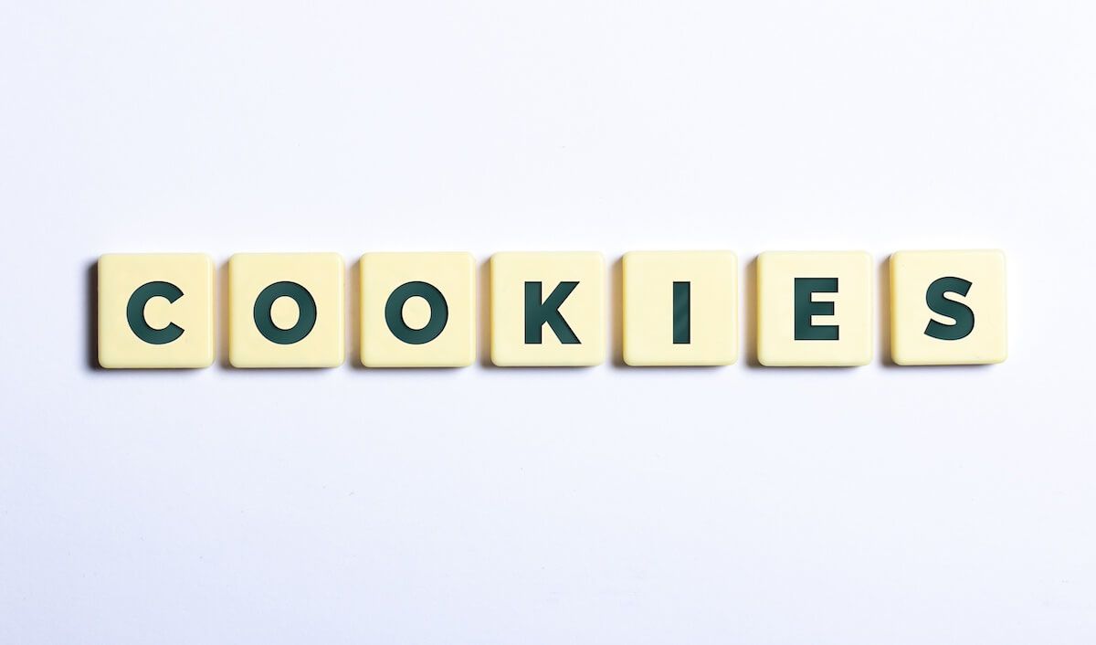 Scrabble tiles spelling out cookies on white background