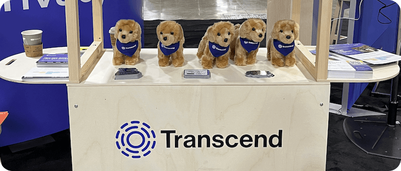 Table from the transcend tradeshow booth sowing wooden display with plush dogs