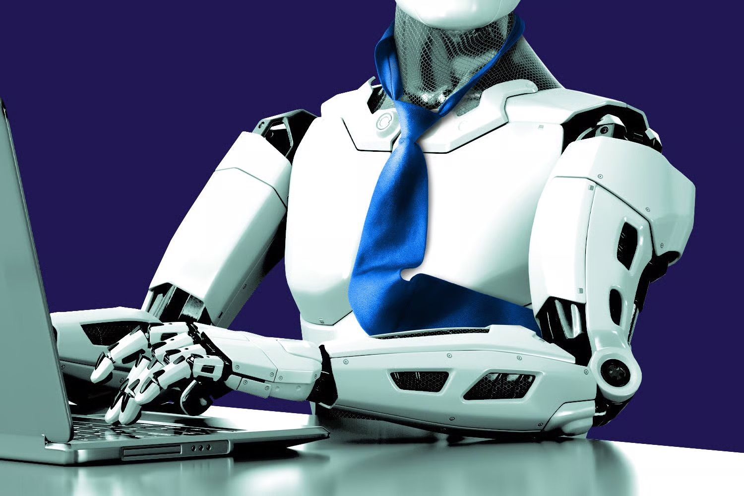 A robot wearing a blue tie types on a laptop.