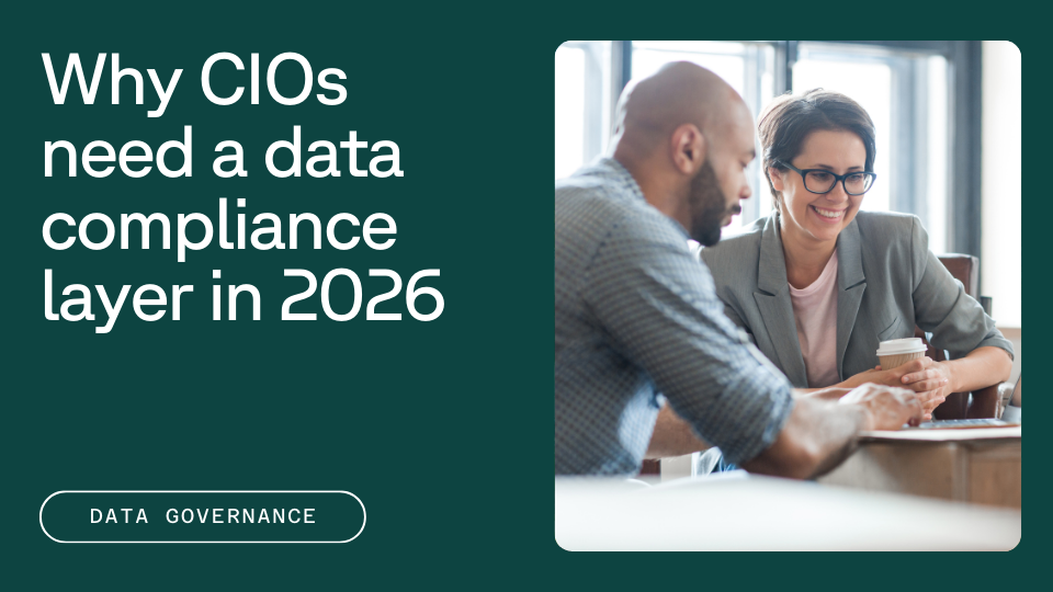 Two people are sitting at a table in an office, discussing something while holding a tablet and a cup of coffee, with the text "Why CIOs need a data compliance layer in 2026" displayed next to them.