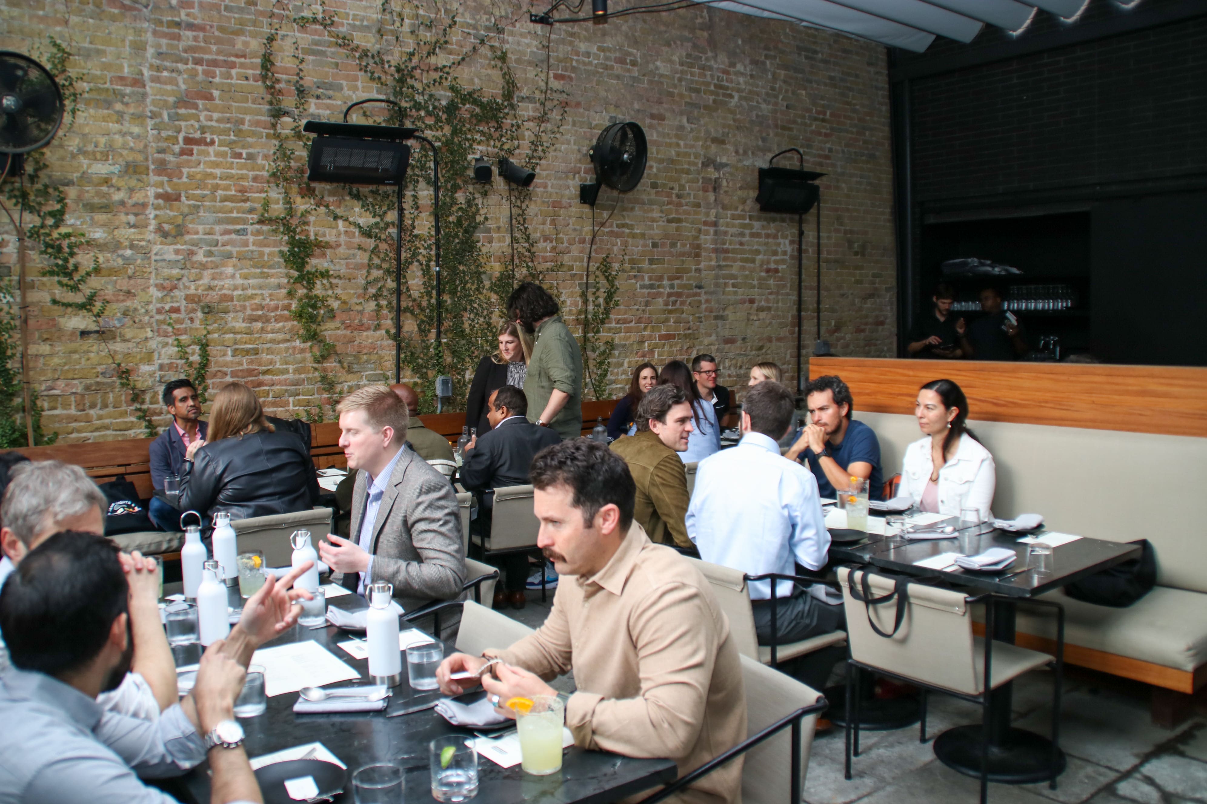 Transcend community enjoying dinner and drinks in upscale restaurant