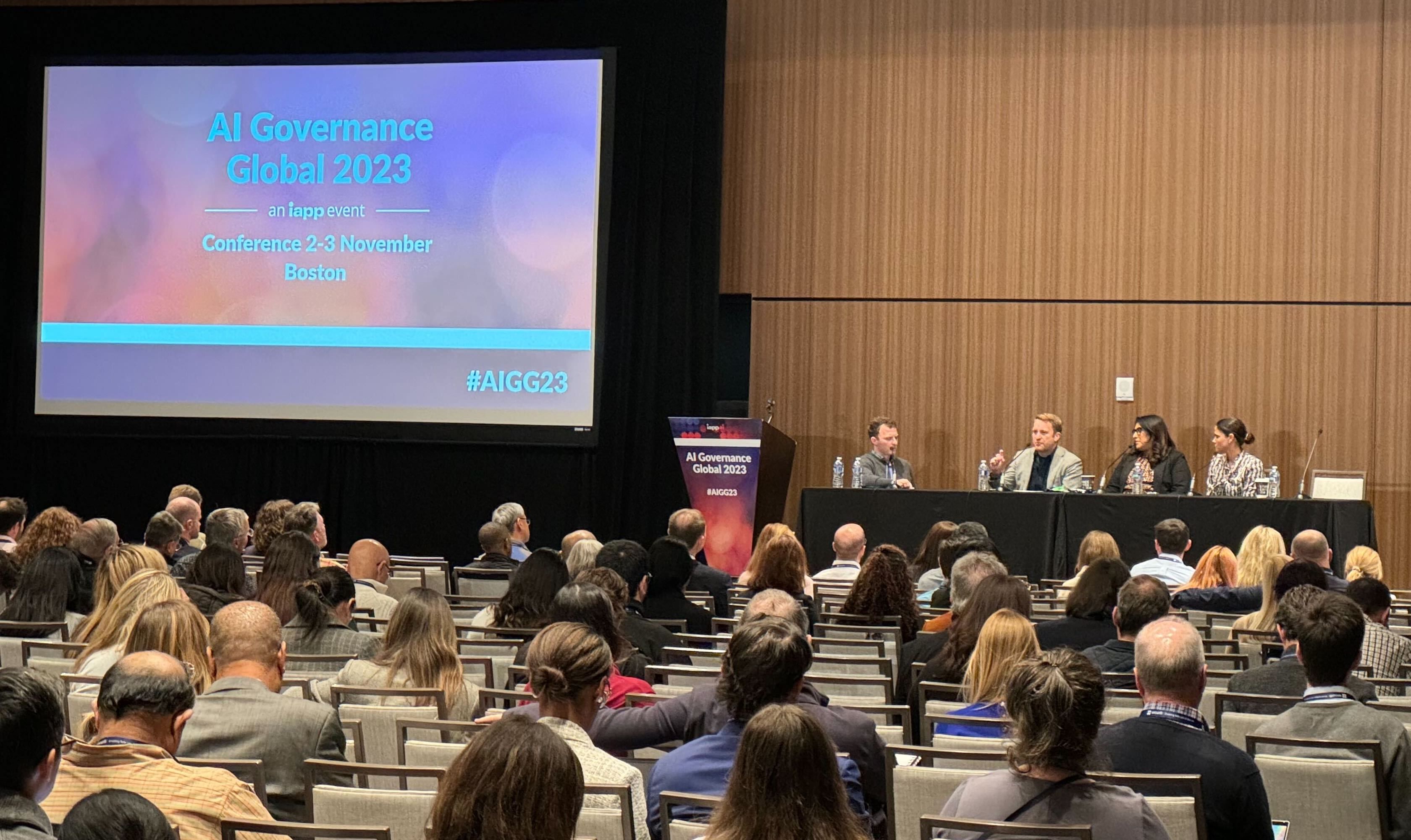 Speaker panel at IAPP AI Governance Global 2023 showing the crowd and speakers on stage