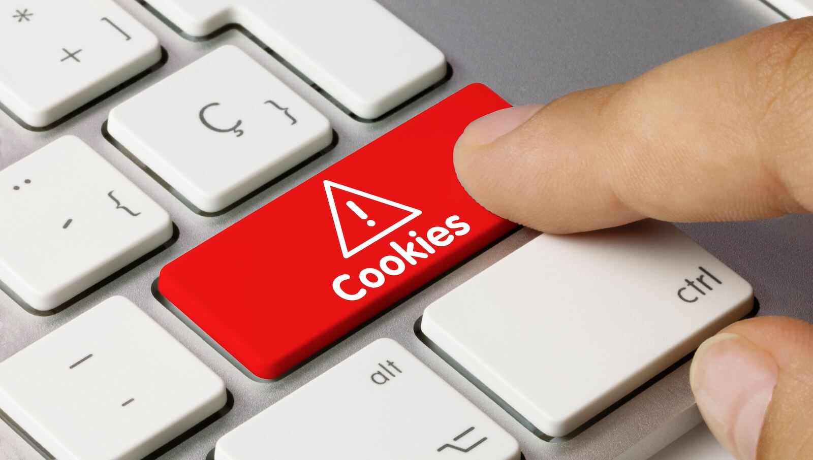 Closeup of finger pressing red cookies button on a keyboard