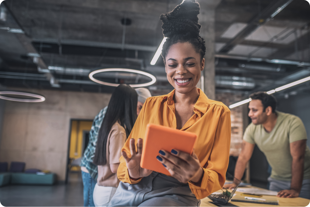 Woman smiling using tablet gives positive impression of opt-in consent ease and transparency