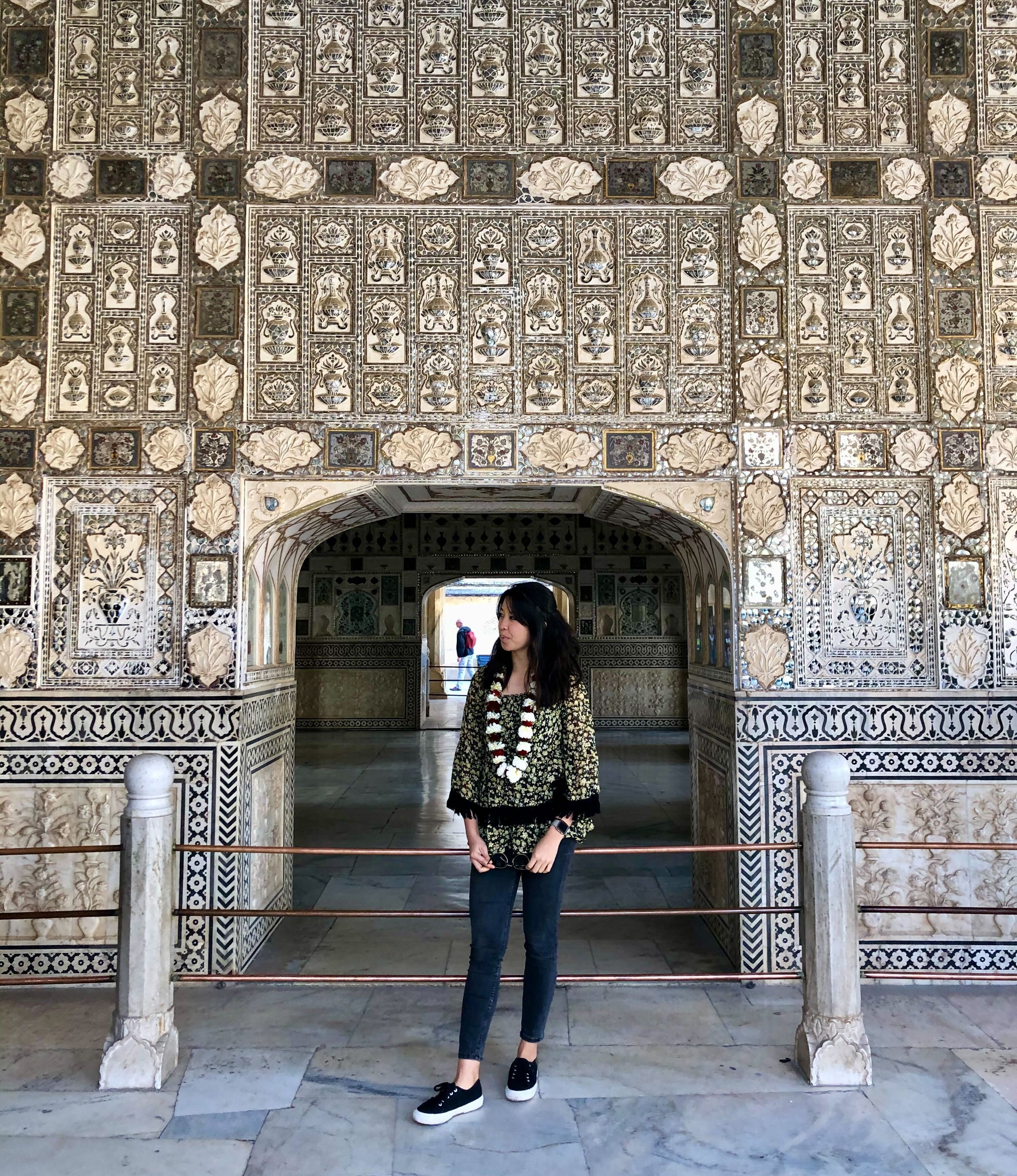 Phyllis Fang standing in front of an ornate doorway