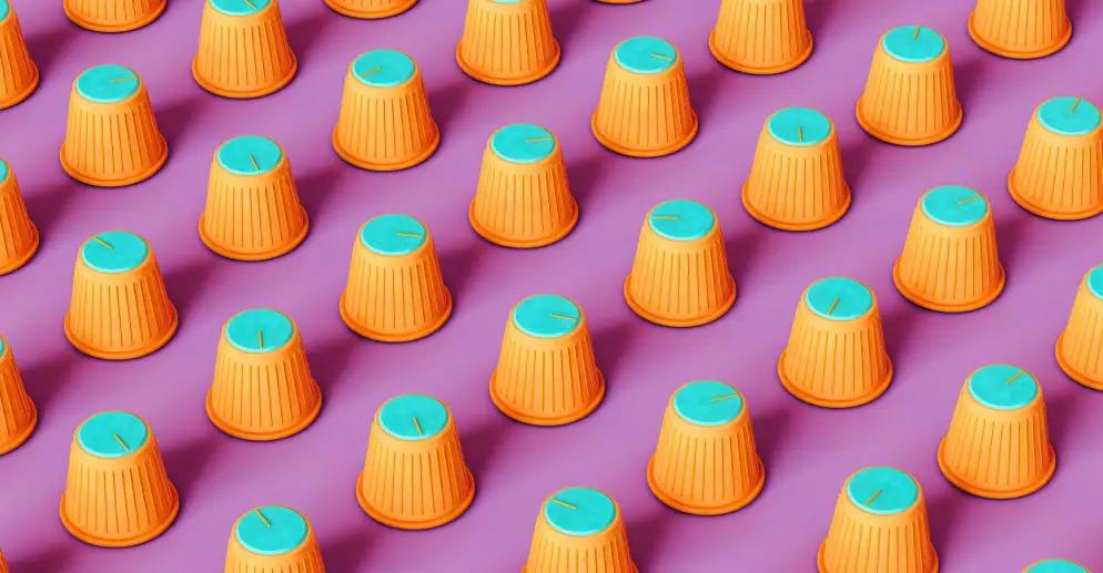 Series of orange and green volume knobs on pink background