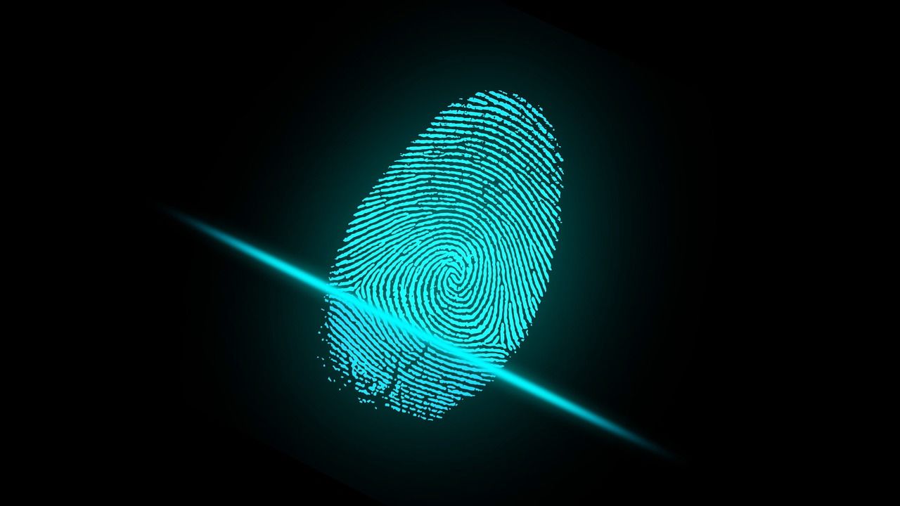 Bright blue fingerprint on black background