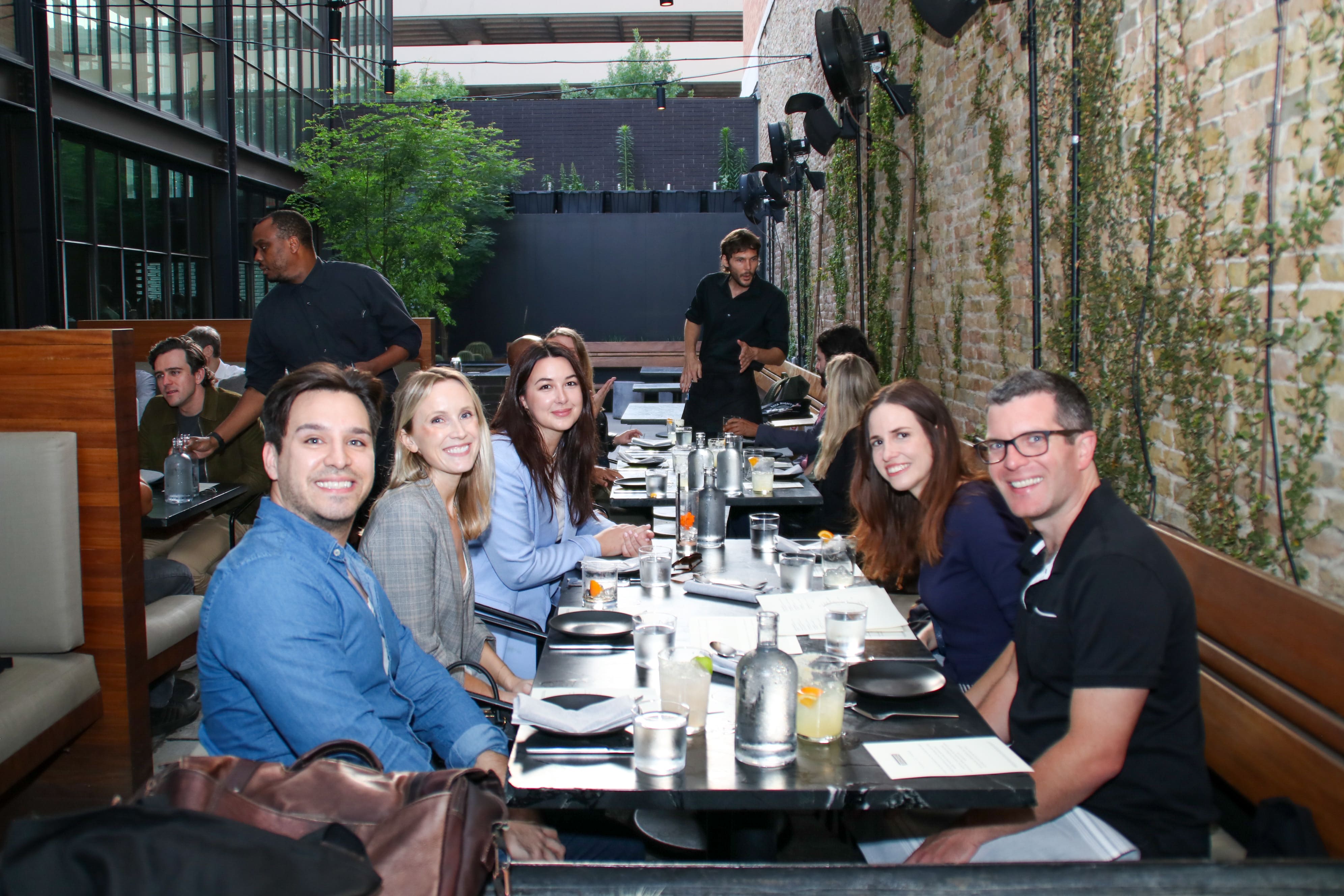Transcend community enjoying dinner and drinks in upscale restaurant