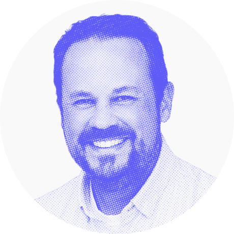 Purple halftone portrait of a smiling man.