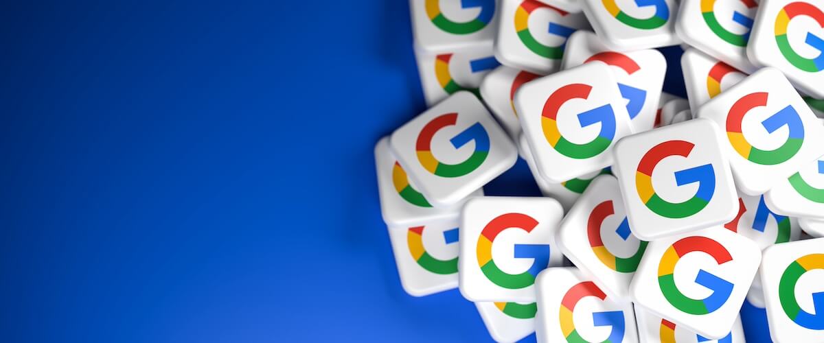 Pile of tiles with the Google G logo in front of blue background