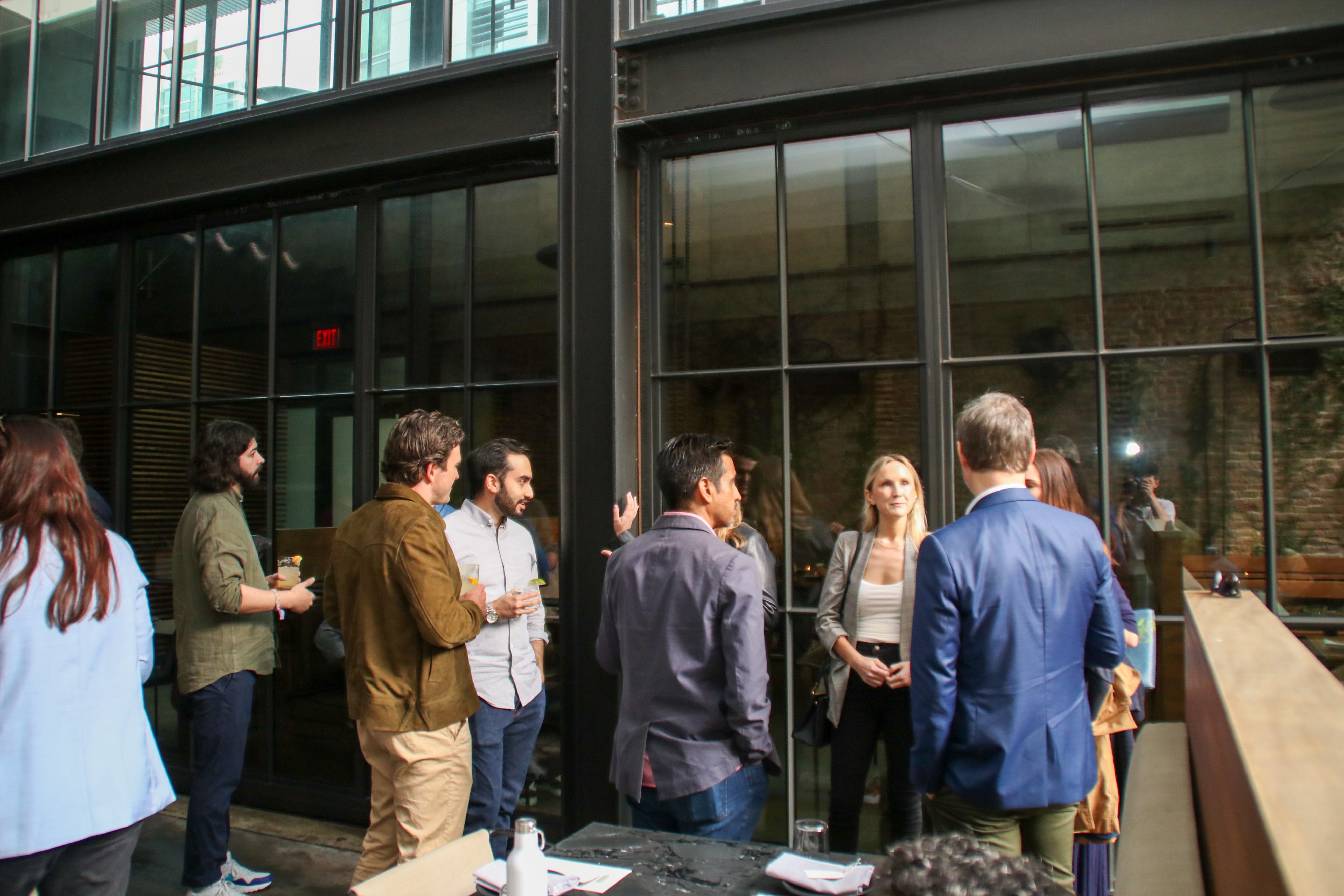 Transcend community enjoying dinner and drinks in upscale restaurant