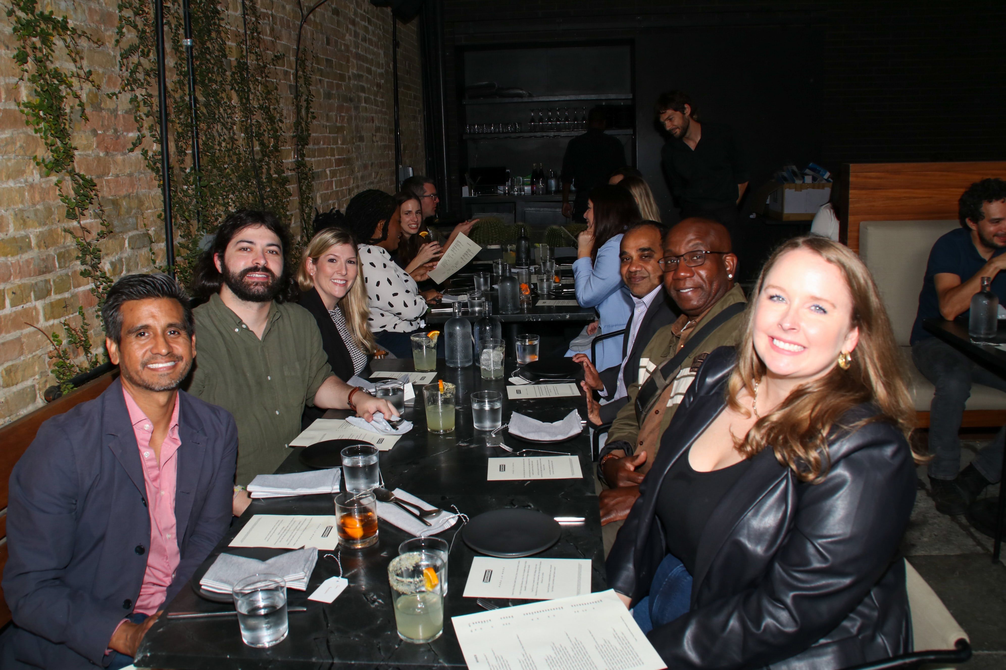 Transcend community enjoying dinner and drinks in upscale restaurant