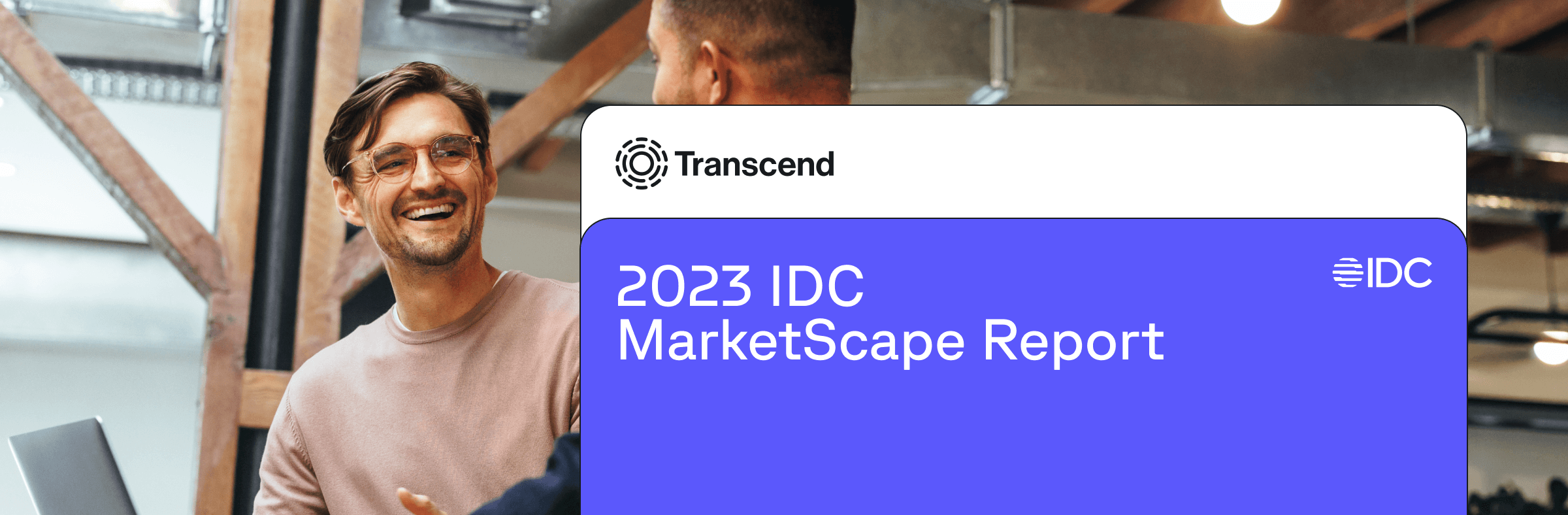 Professionals smiling in an office with Transcend graphic overlayed reading 2023 IDC MarketScape report