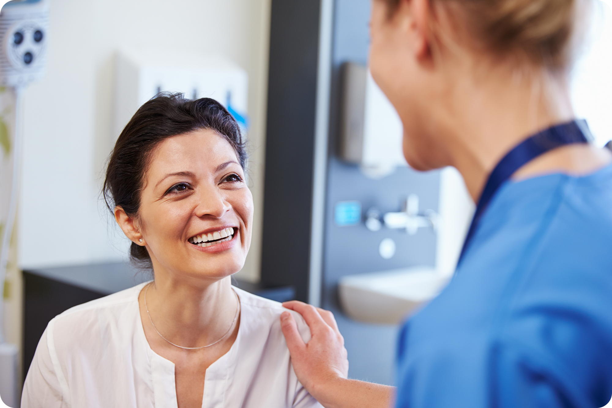 Smiling patient talking to a nurse