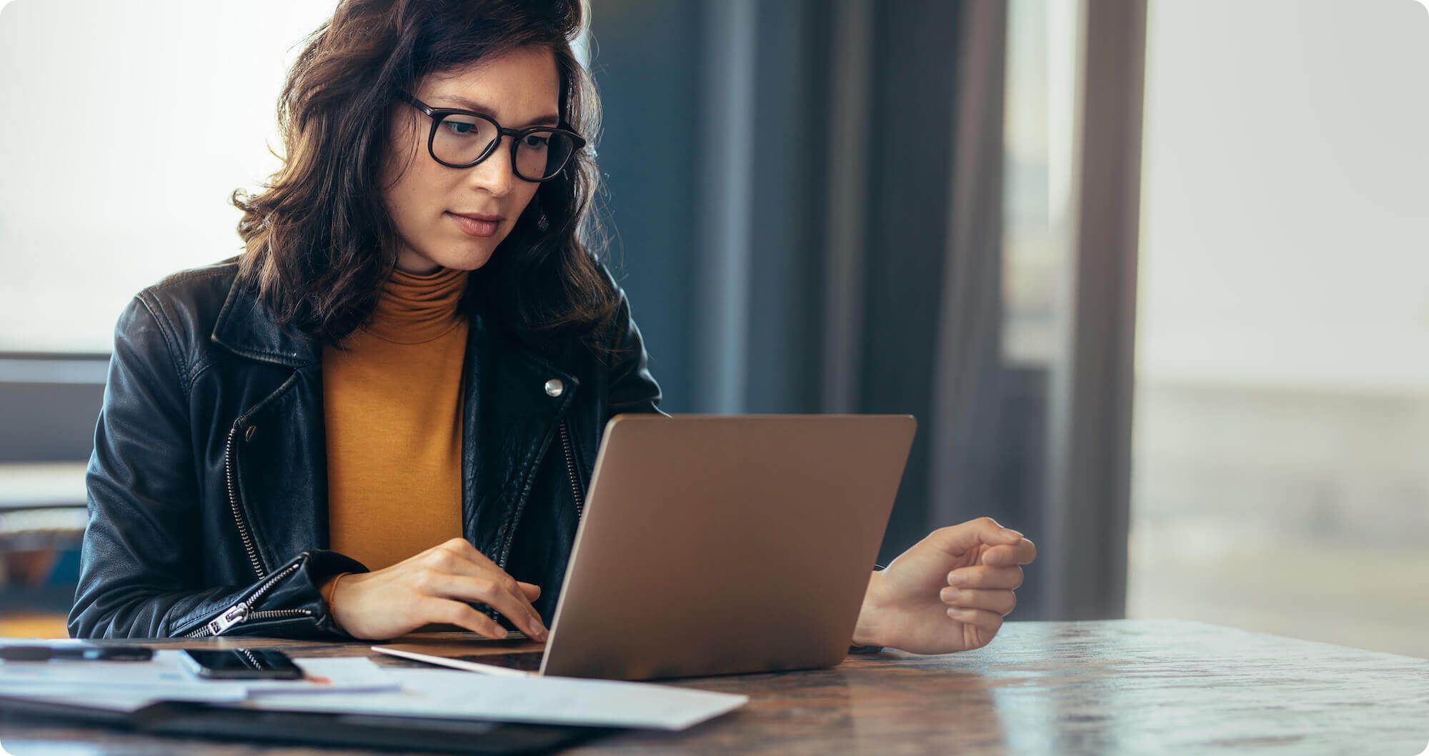 Professional focused on computer work at desk
