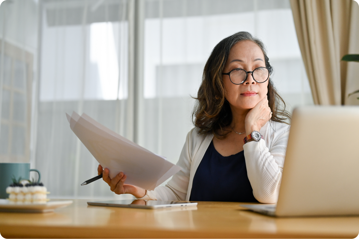 Woman looking closely at computer perhaps reading opt out consent examples