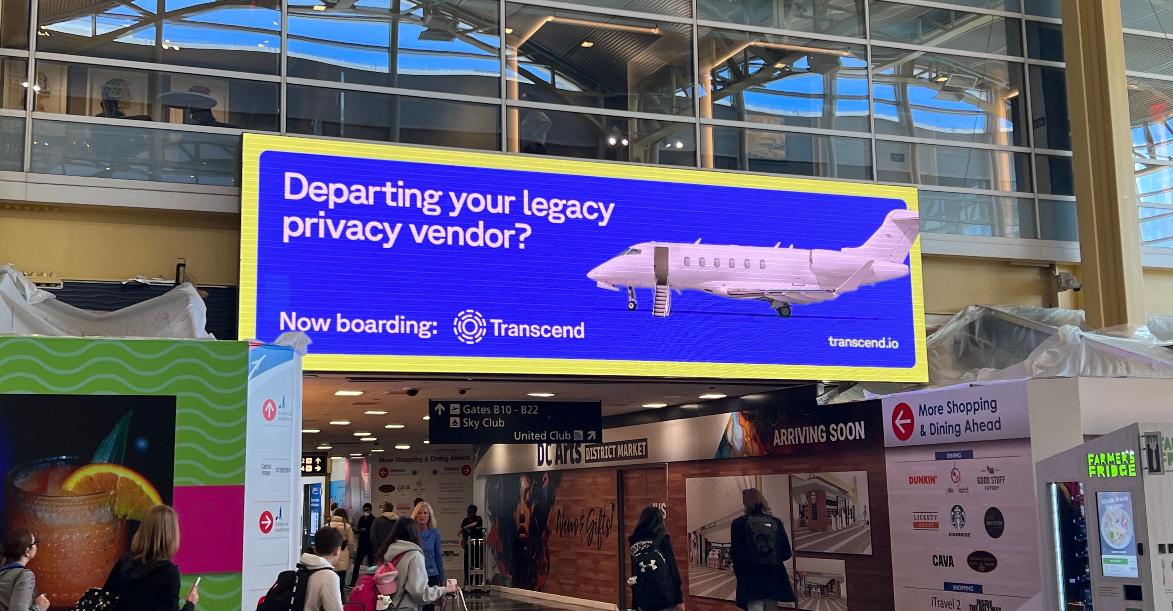 View of an airport with transcend display advertisement on screen reading departing your legacy privacy vendor?