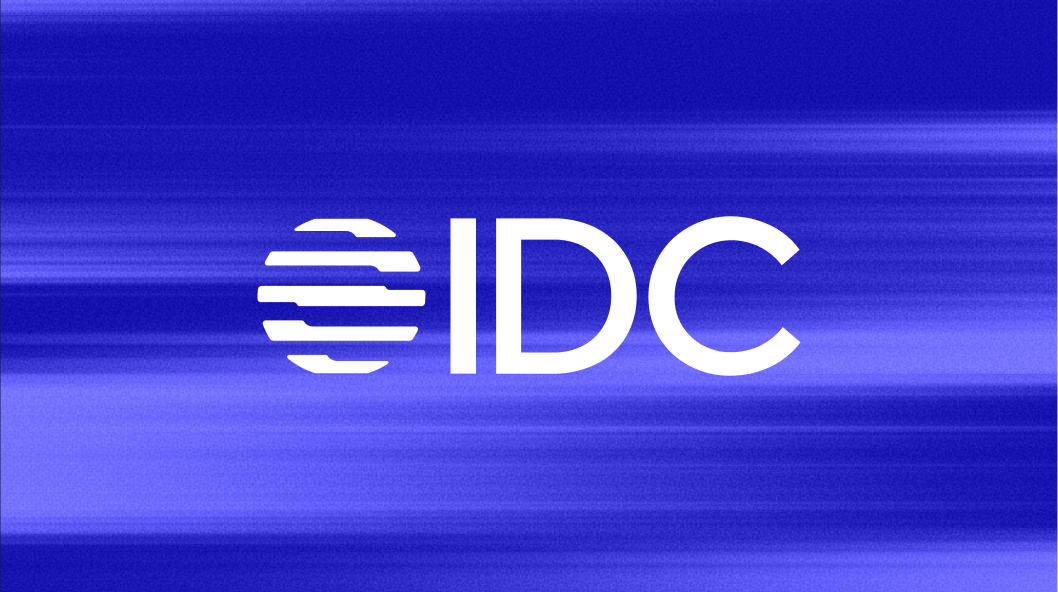 An image of the IDC logo on a blue patterned background.