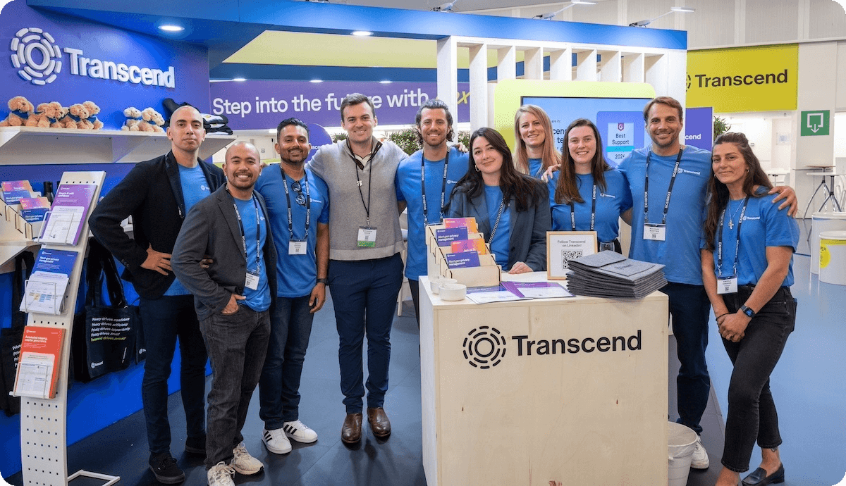 The Transcend team standing in front of their trade show display at IAPP AIGG in Brussels