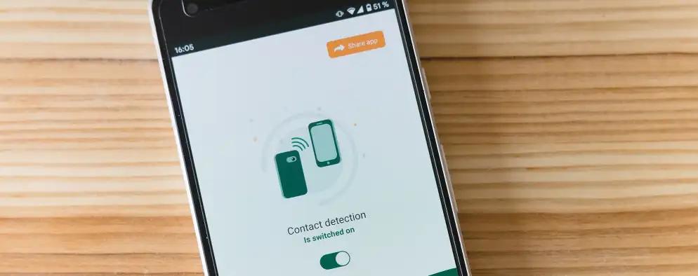 A smartphone screen displaying an app with the message "Contact detection is switched on," featuring an illustration of two connected phones and a toggle switch.