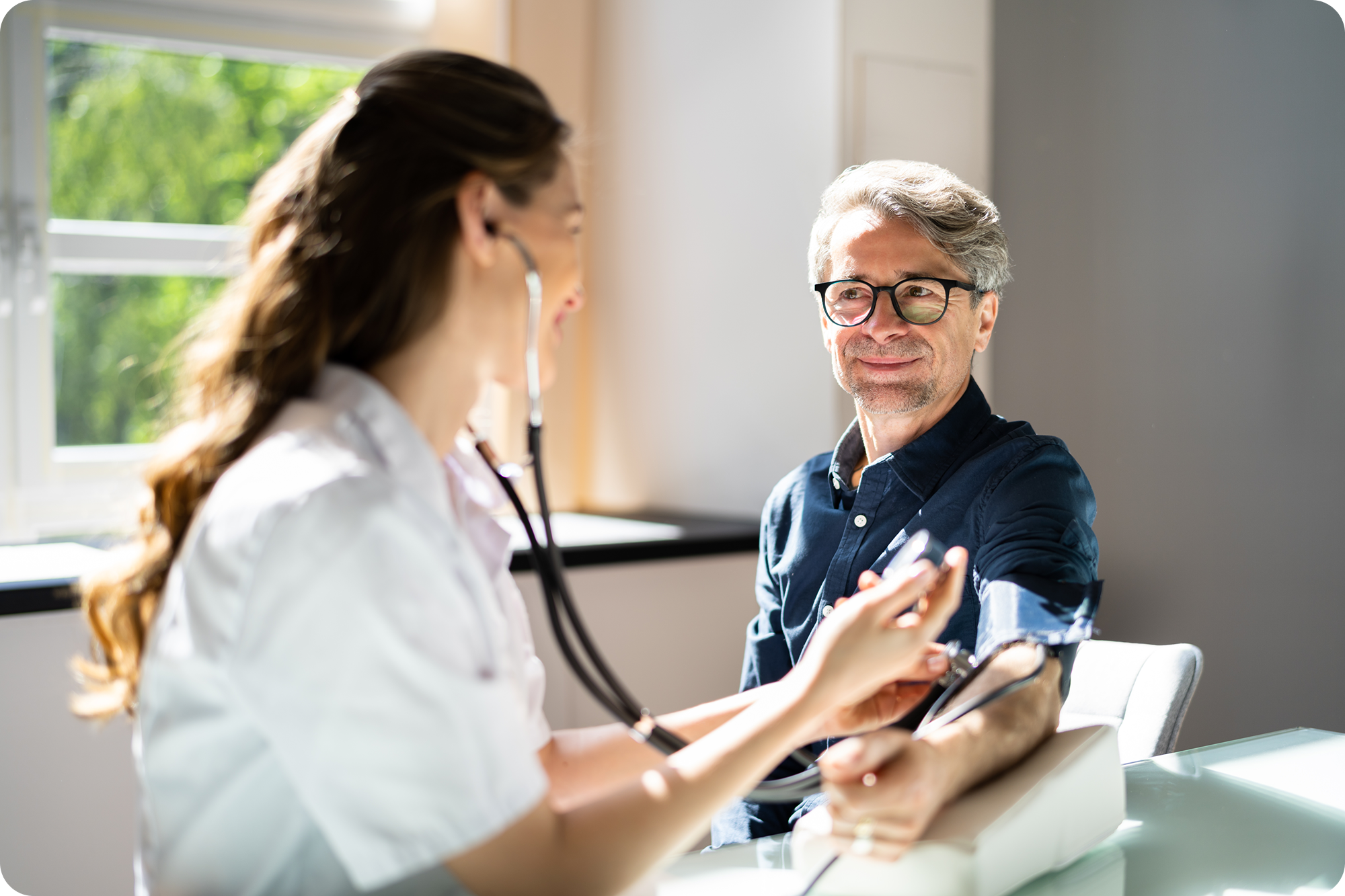 Nurse listening to the pulse of a patient