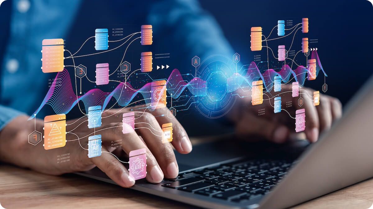 Closeup of hands using laptop with data flow chart overlay floating in front of them
