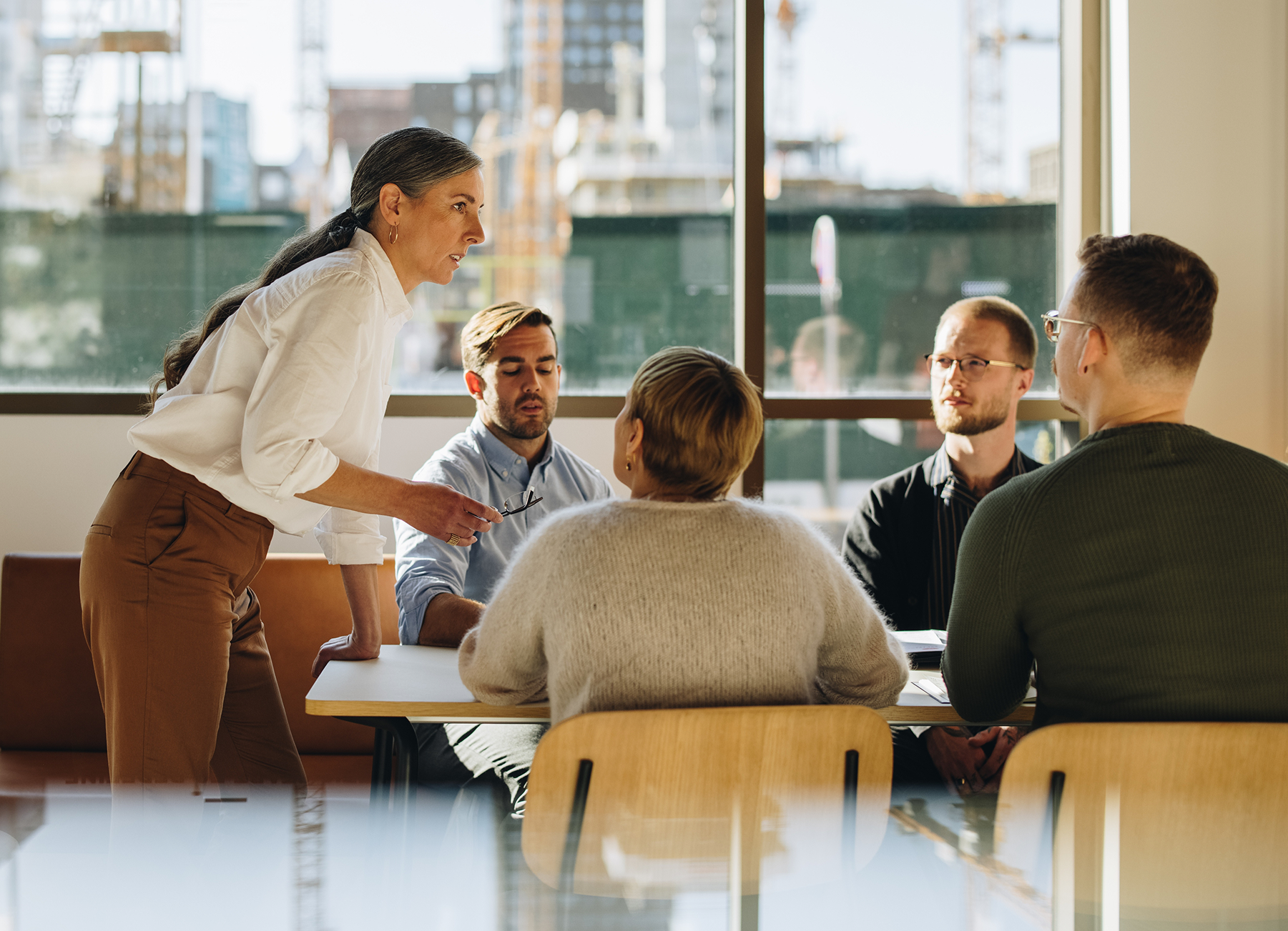 Professional woman leading a meeting in a conference room